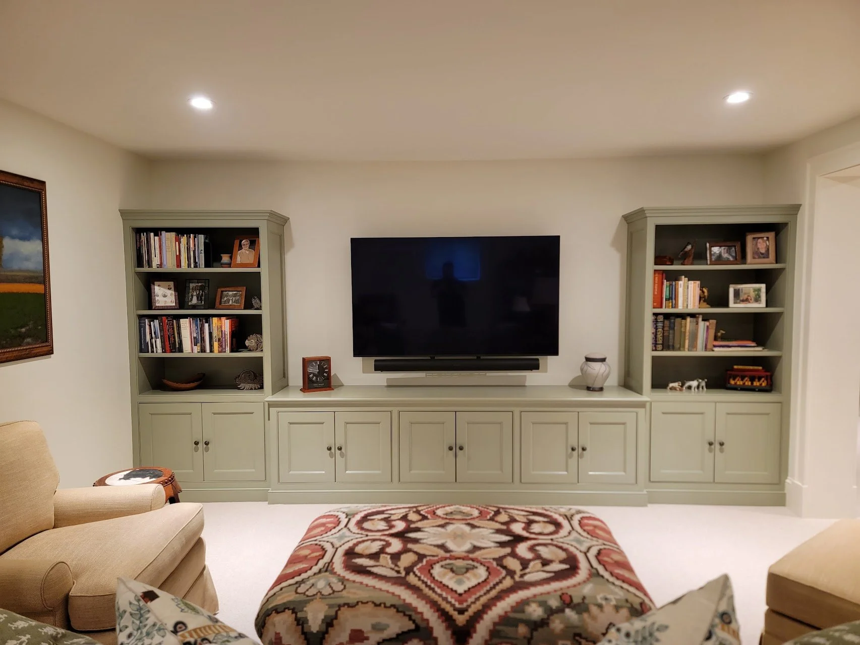 Built-in entertainment center designed to balance media storage with surrounding architectural elements.