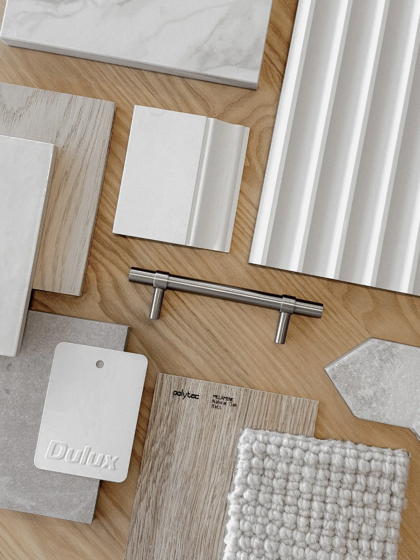 We created this interiors palette for a client who wanted a modern Hamptons aesthetic with a refined and timeless feel. Our idea was to create interest through texture rather than colour, layering shades of soft whites, warm oak timber elements, and 