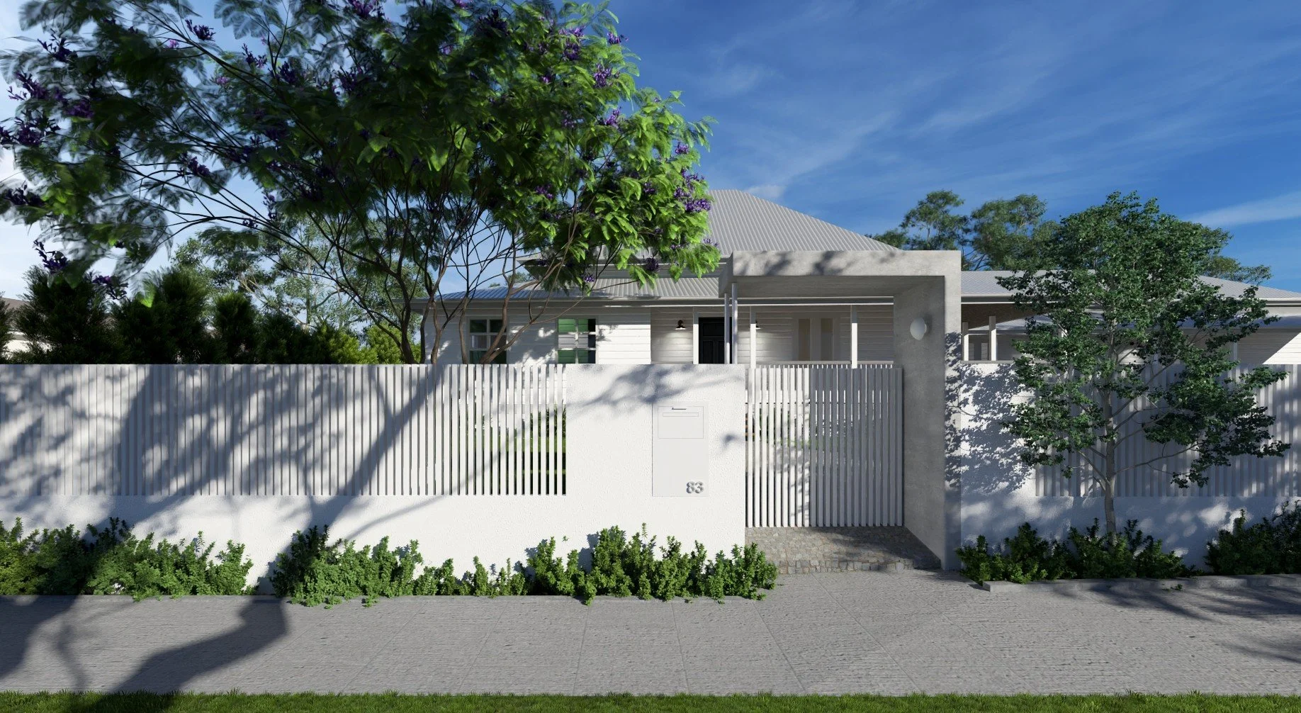 A modern white house with a white fence, trees, and a sidewalk in front, under a blue sky.