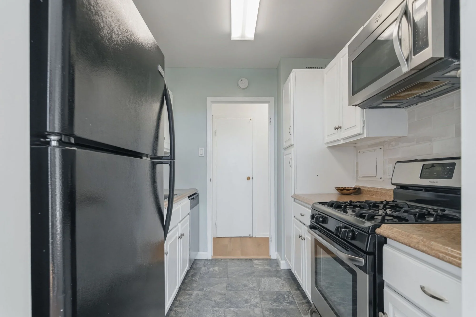 16-samantha-bard-301-n-beauregard-st-unit-902-kitchen-galley-view-fridge-alexandria-va-22312.jpg
