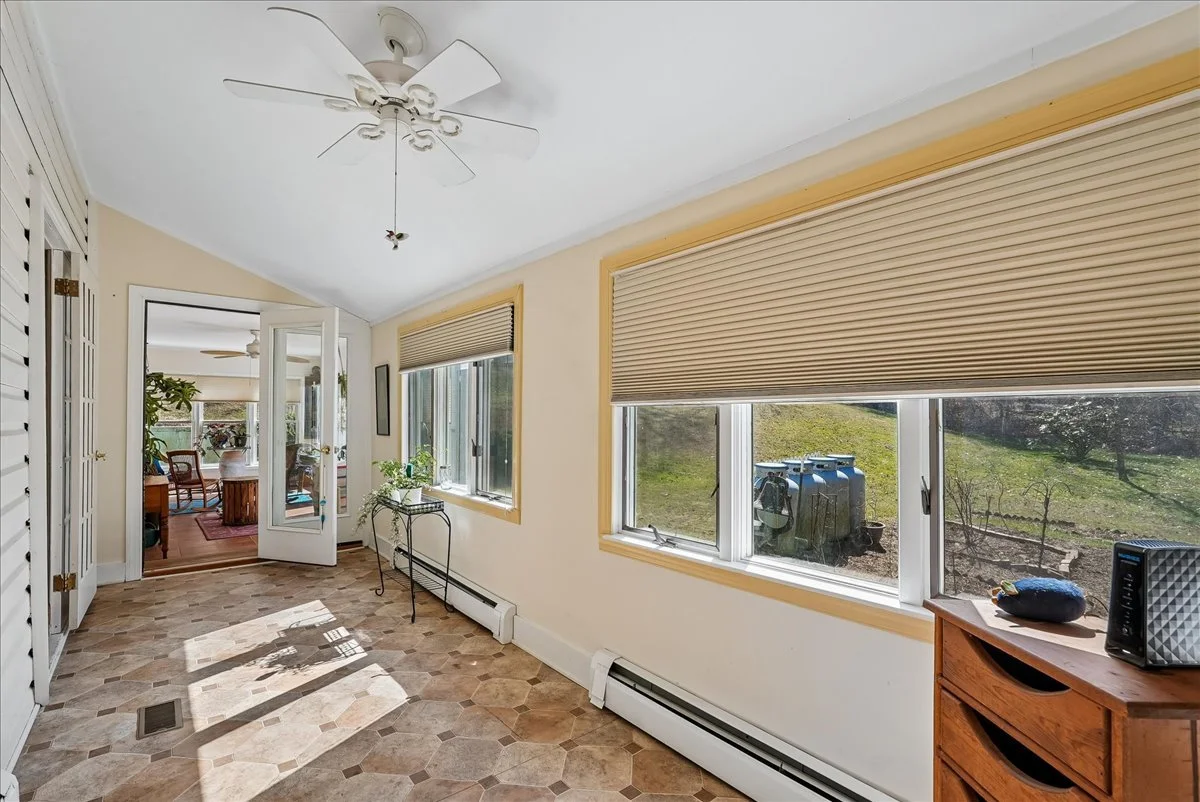 36-samantha-bard-13064-furnace-mountain-rd-hallway-tile-sunroom-access-lovettsville-va-20180.jpg