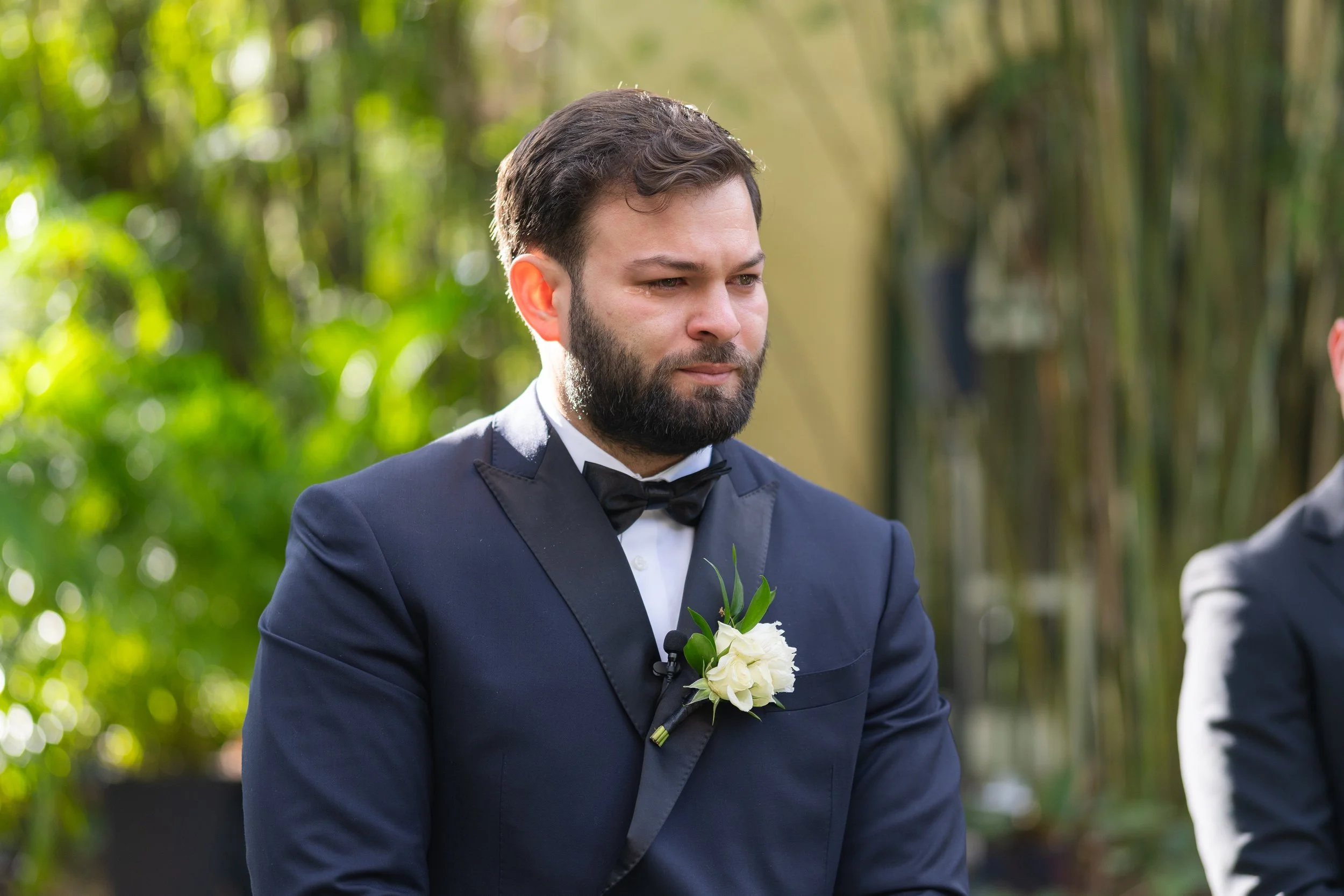 Classic groom portrait in a black tuxedo at Villa Woodbine; fine art wedding photography by Star Visual Art, Miami.