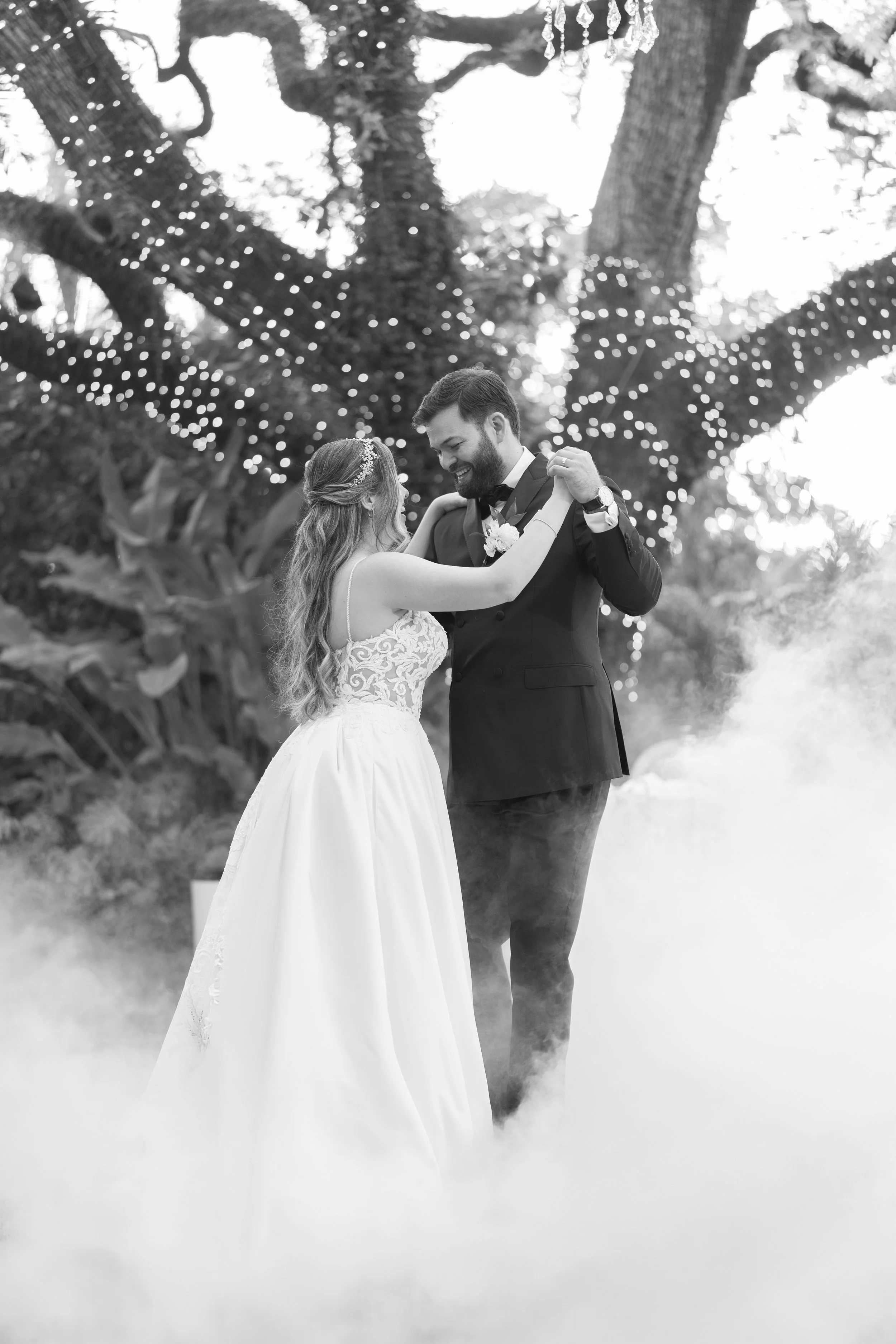 Romantic first dance during an outdoor wedding reception at Villa Woodbine; fine art photography by Star Visual Art, Miami.