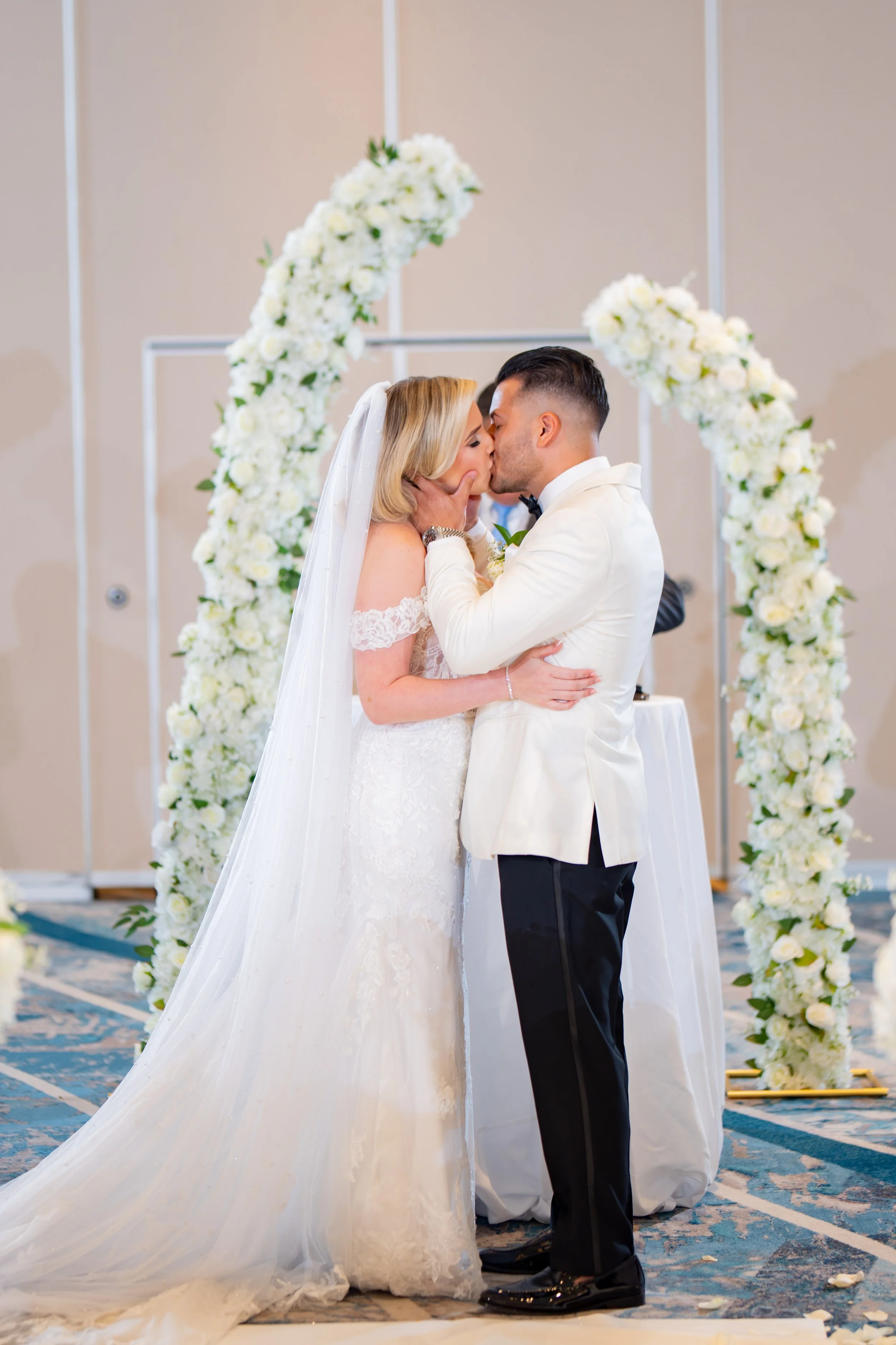 Bride and groom during their romantic ceremony at HILTON TAMPA DOWNTOWN; professional wedding photography by Star Visual Art, Tampa.