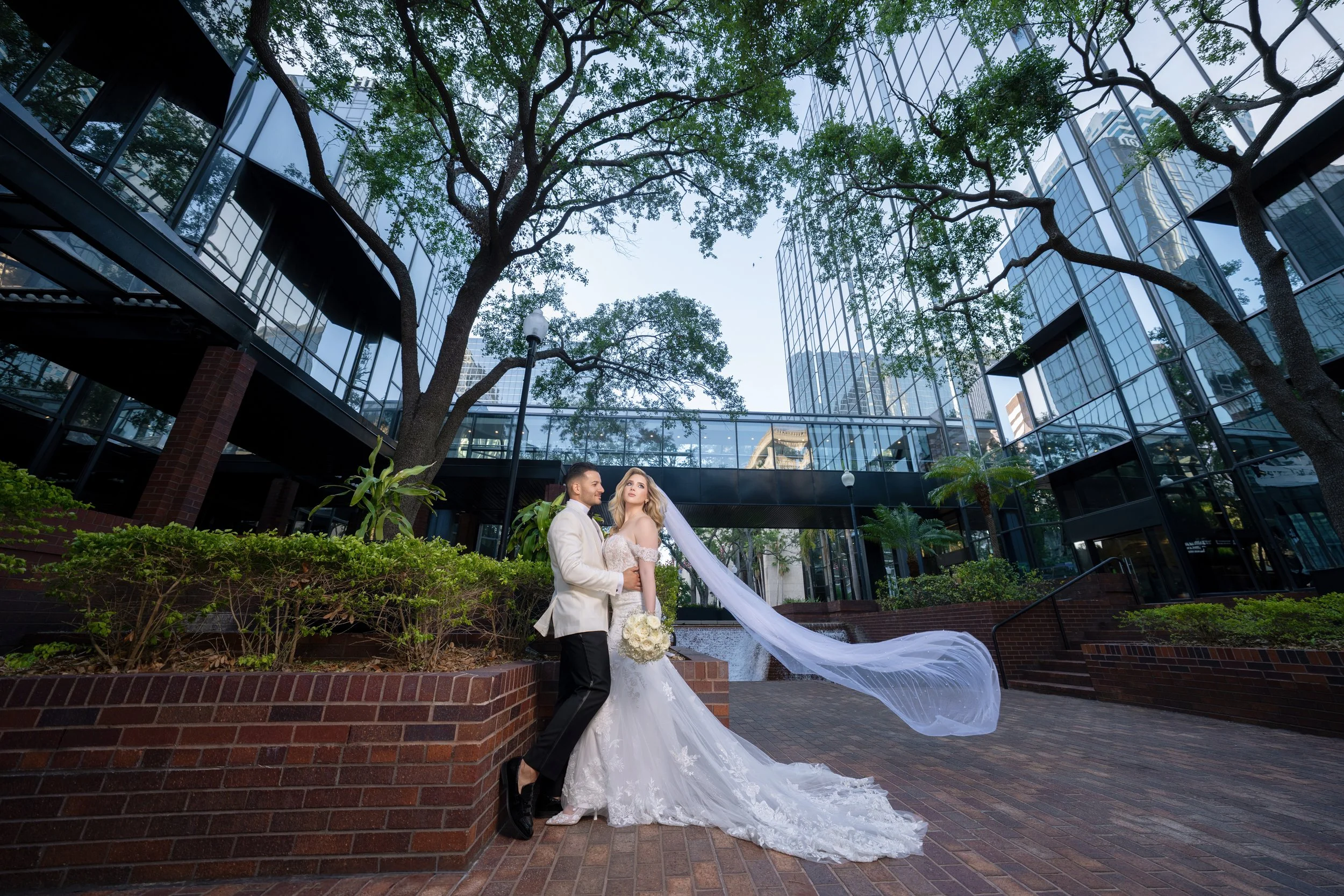 Dramatic wedding portrait with a flying veil at HILTON TAMPA DOWNTOWN; creative fine art photography by Star Visual Art, Tampa.