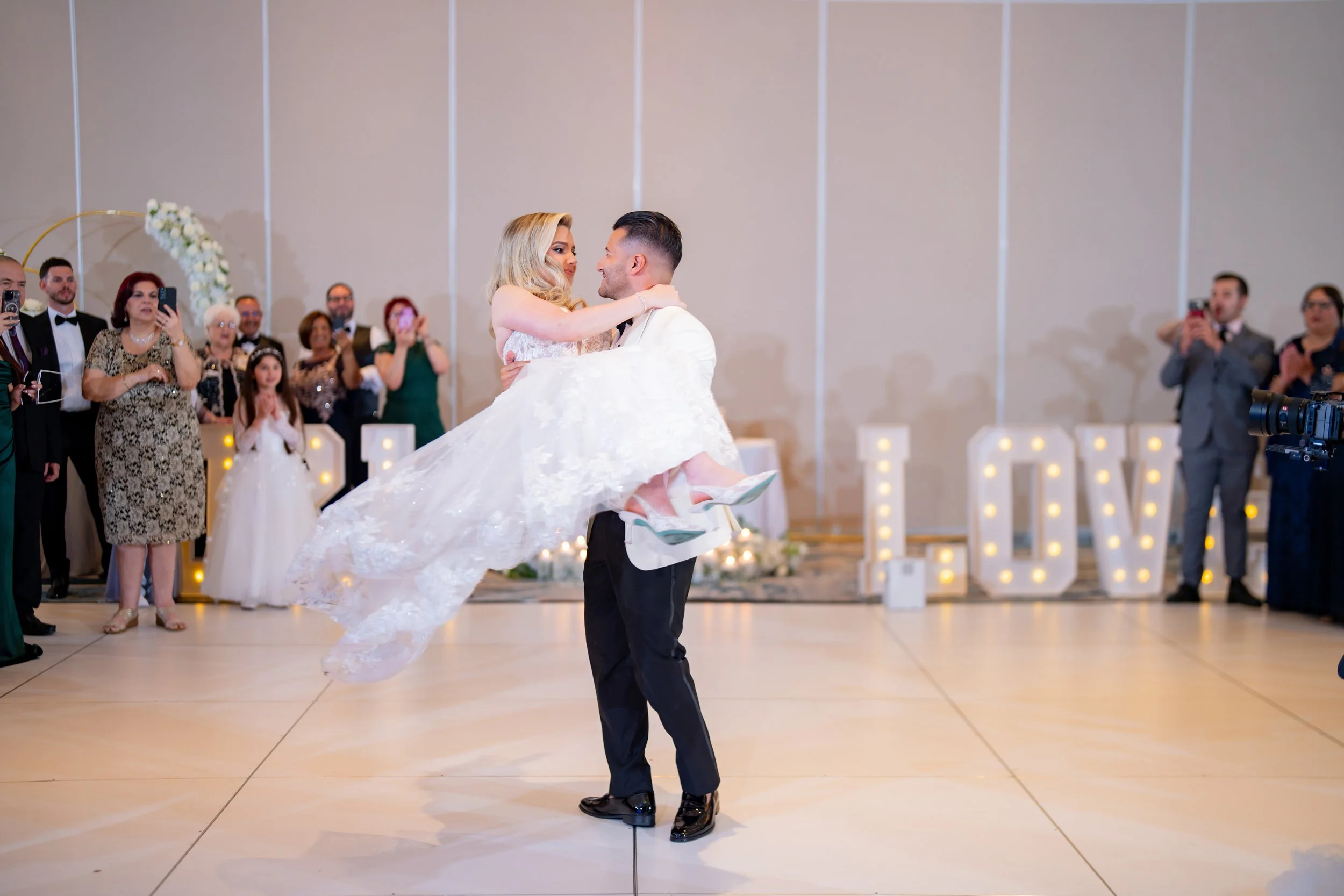 Epic first dance dip at HILTON TAMPA DOWNTOWN; cinematic wedding reception photography by Star Visual Art, Tampa.
