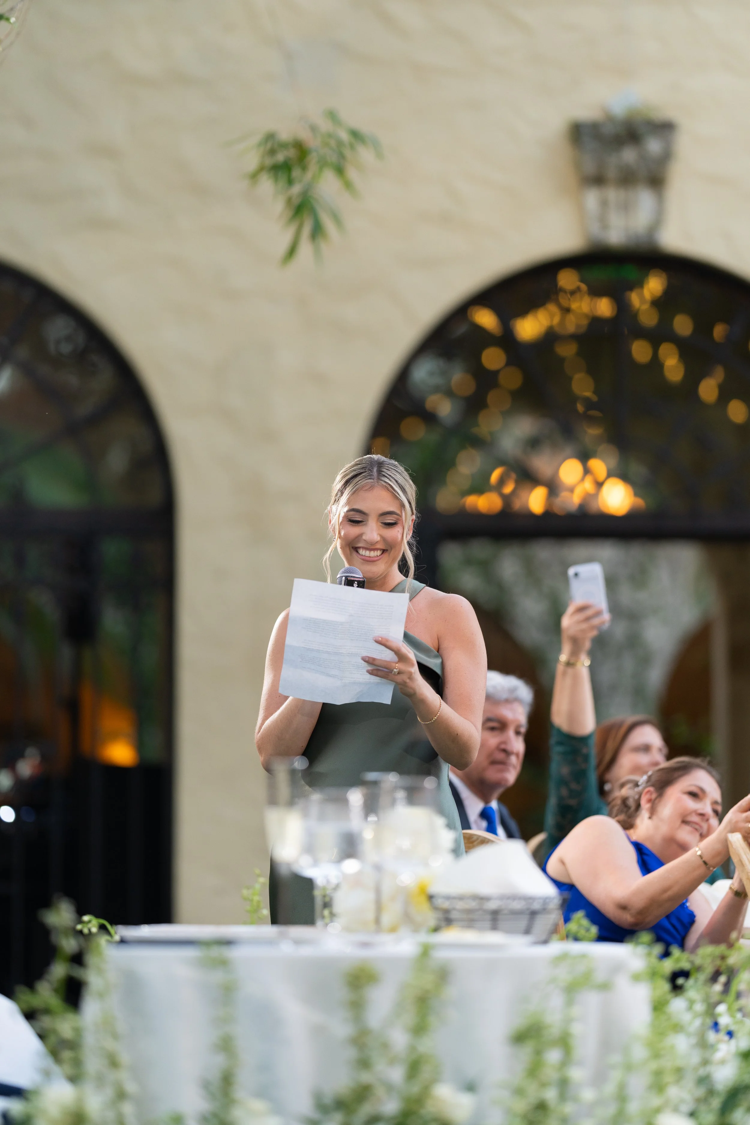 Emotional wedding speeches and toasts during an outdoor reception at Villa Woodbine; fine art photography by Star Visual Art, Miami.
