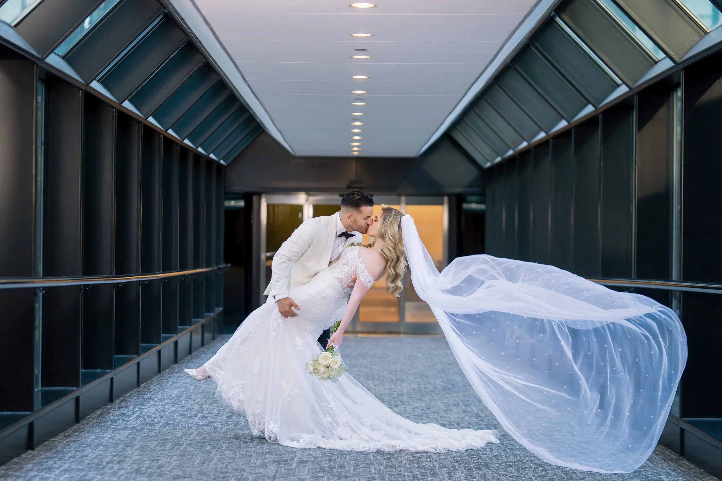 Romantic outdoor couple portrait with hanging lights at HILTON TAMPA DOWNTOWN; fine art wedding photography by Star Visual Art, Tampa.
