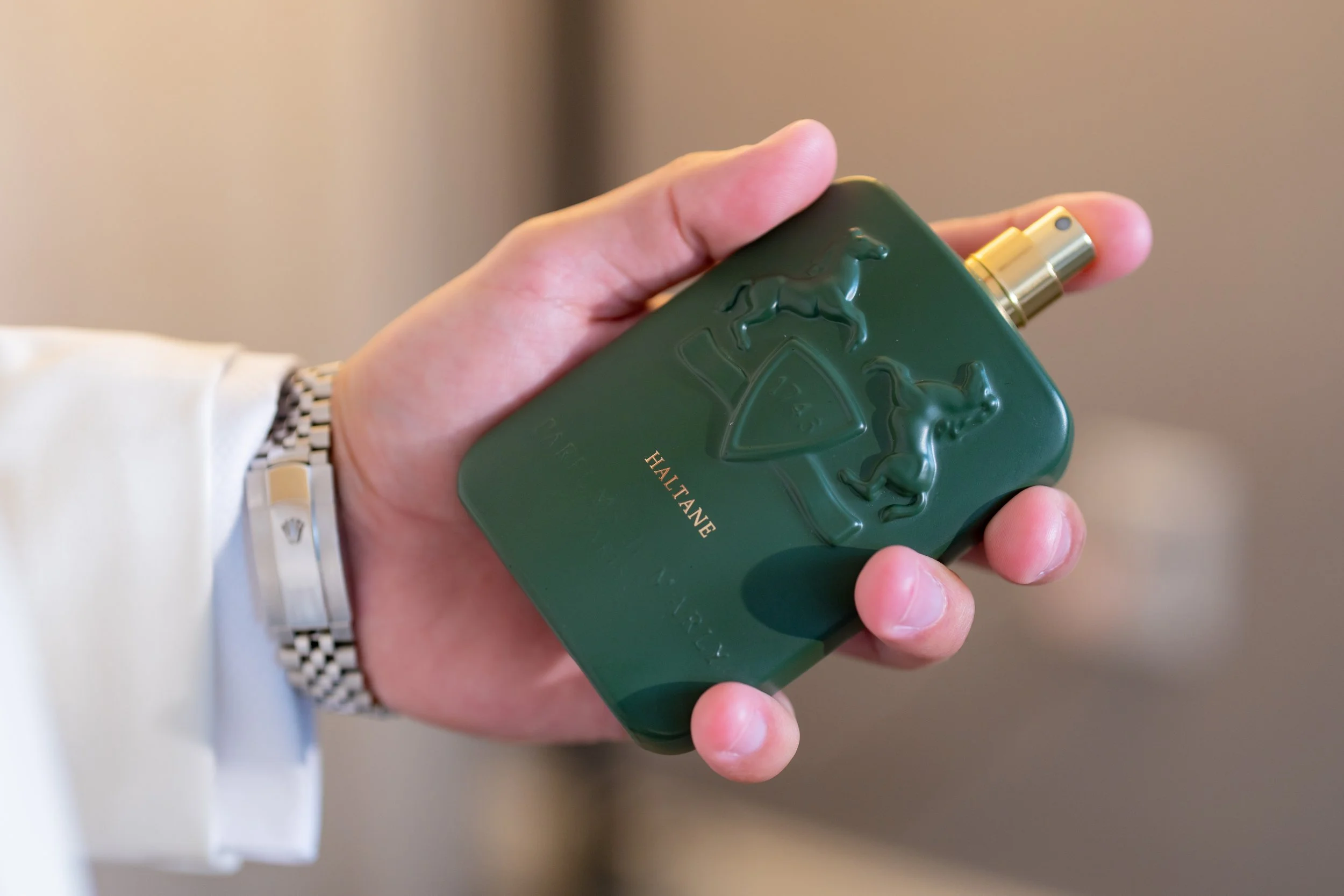 Luxury Parfums de Marly cologne during the groom's preparation at HILTON TAMPA DOWNTOWN; fine art wedding detail photography by Star Visual Art, Tampa.