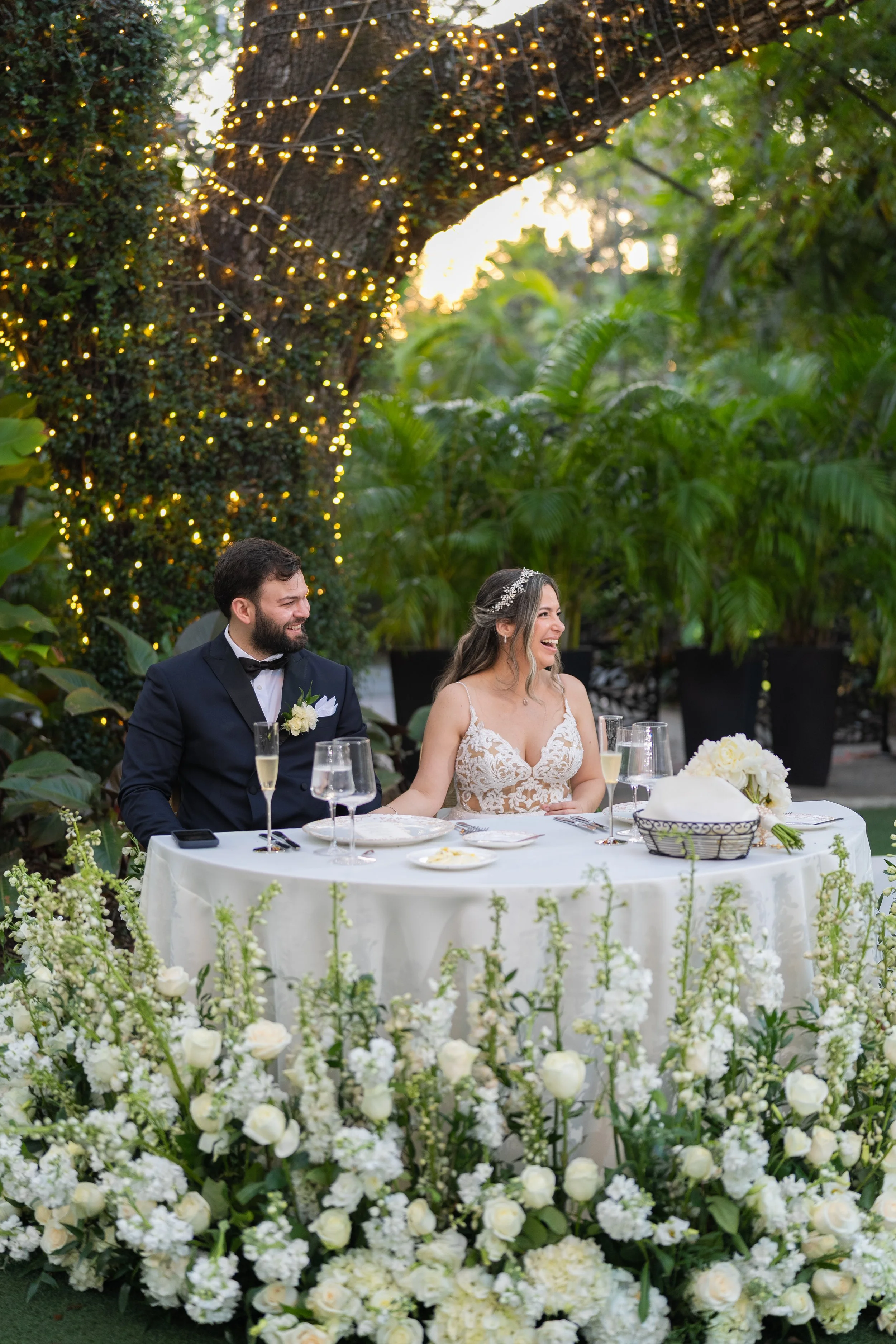 Emotional newlyweds' reactions during wedding speeches at Villa Woodbine; luxury reception photography by Star Visual Art, Miami.