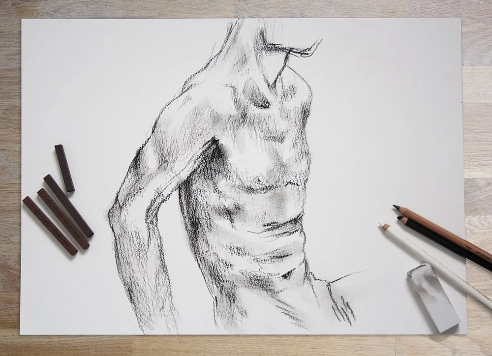 life drawing of a male figure in charcoal