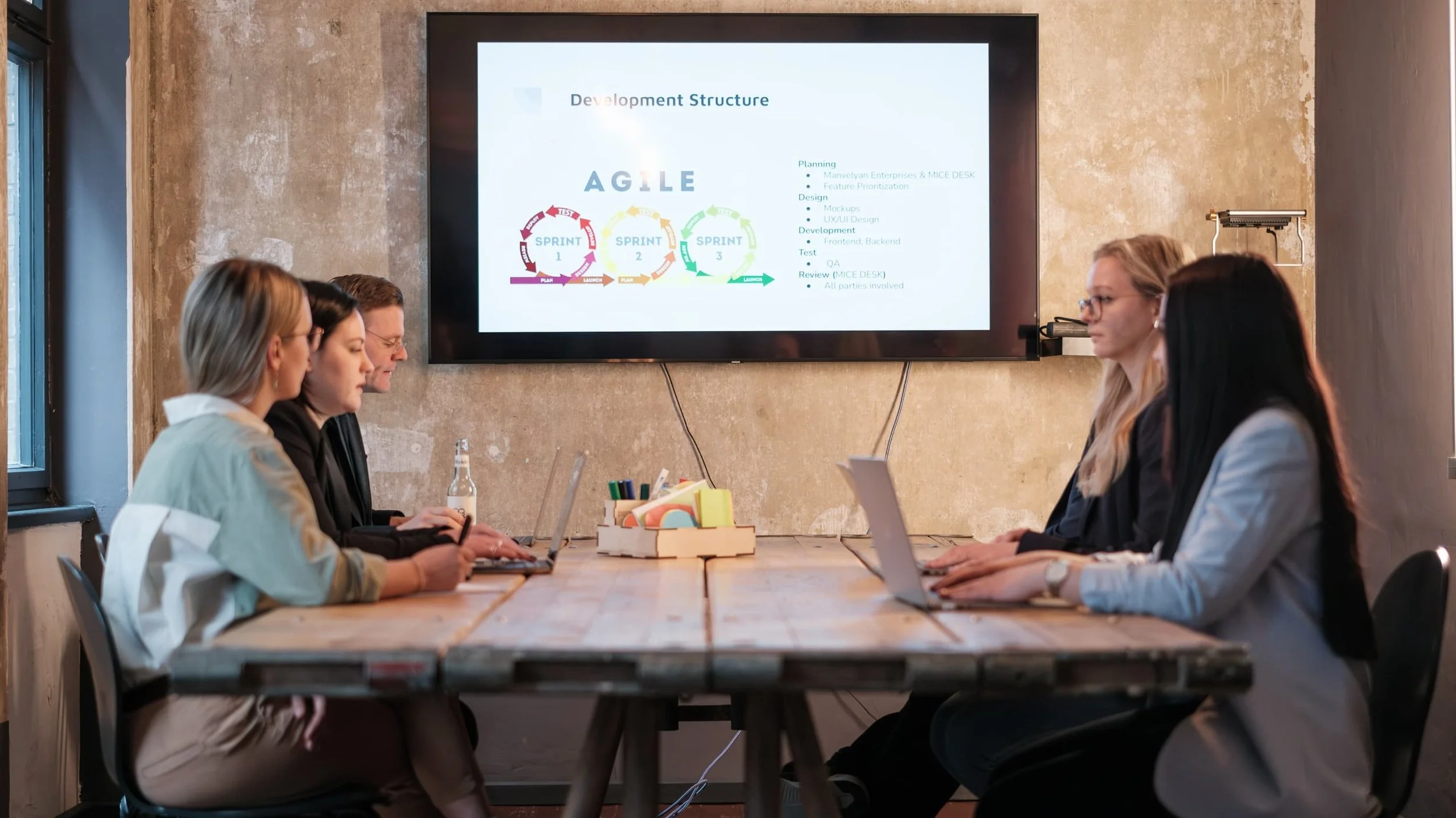 People sitting at a meeting table