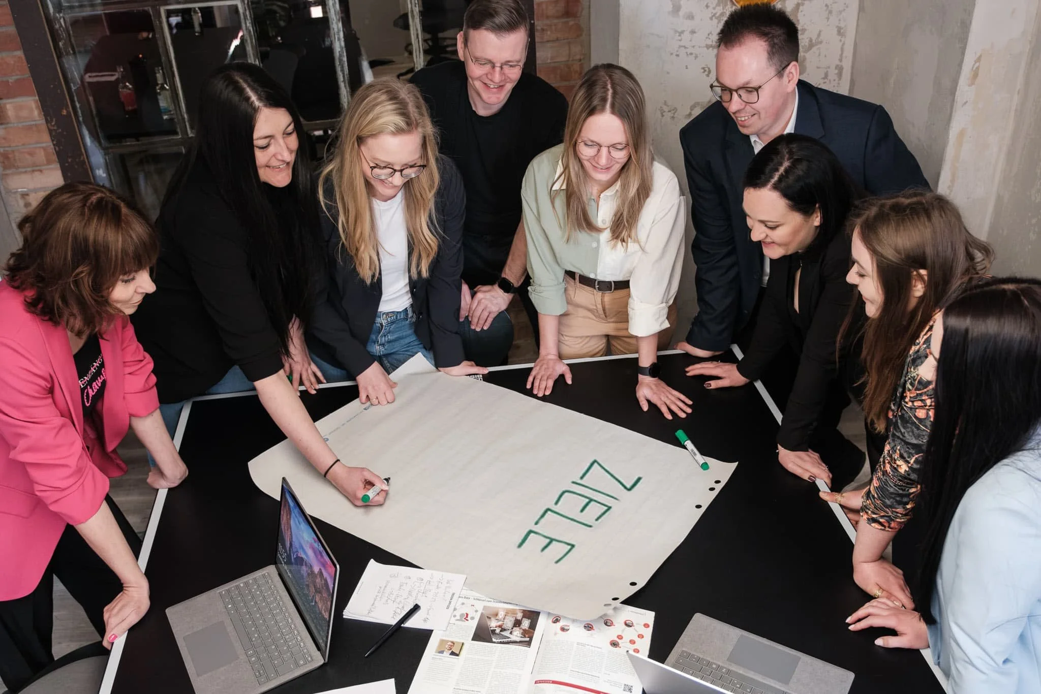 A team of colleagues working together on a mind map