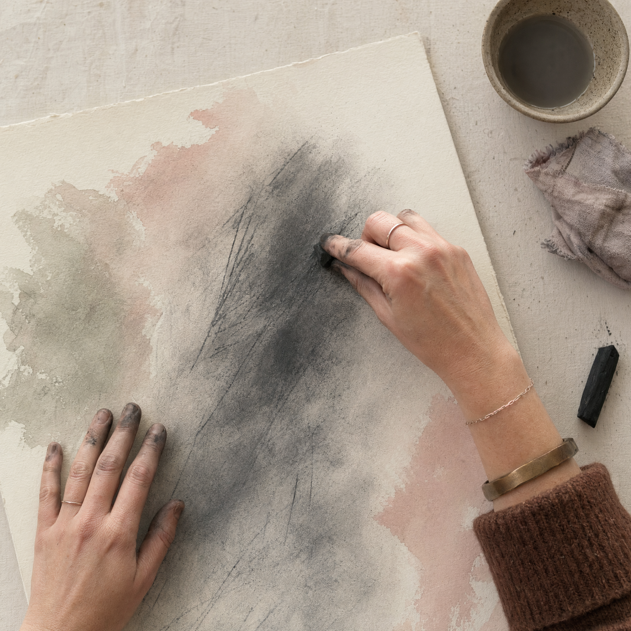 hands drawing an anxious painting