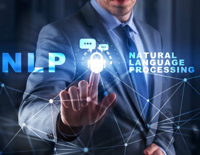 A man in a suit interacting with a virtual interface displaying words 'NLP' and 'Natural Language Processing' along with digital graphics related to AI and communication.