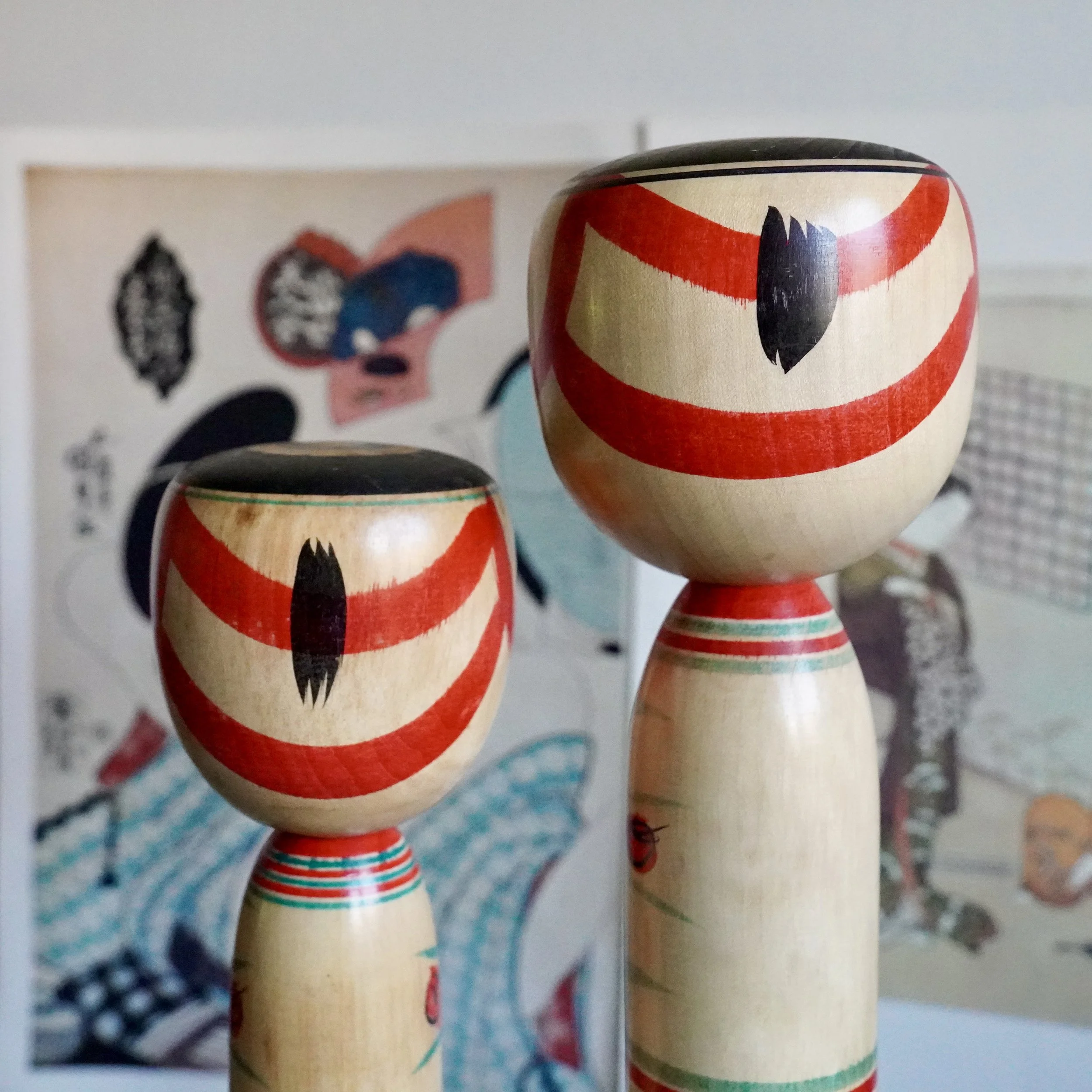 Detail of Nakanosawa Takobozu kokeshi heads, oversized wood carved form with painted hair, signed Saito Tokuju kokeshi