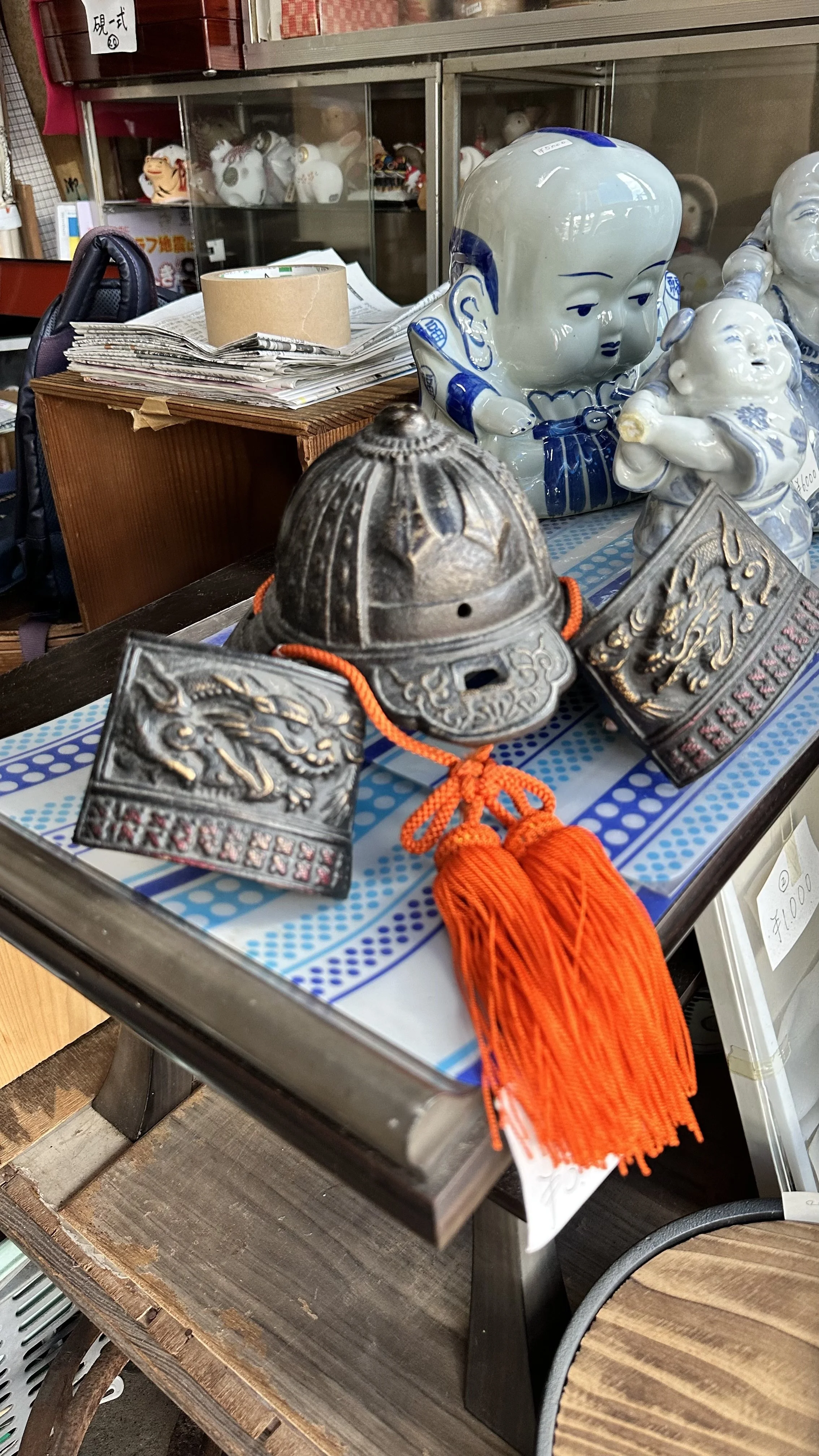Miniature samurai kabuto helmet with orange silk tassels
