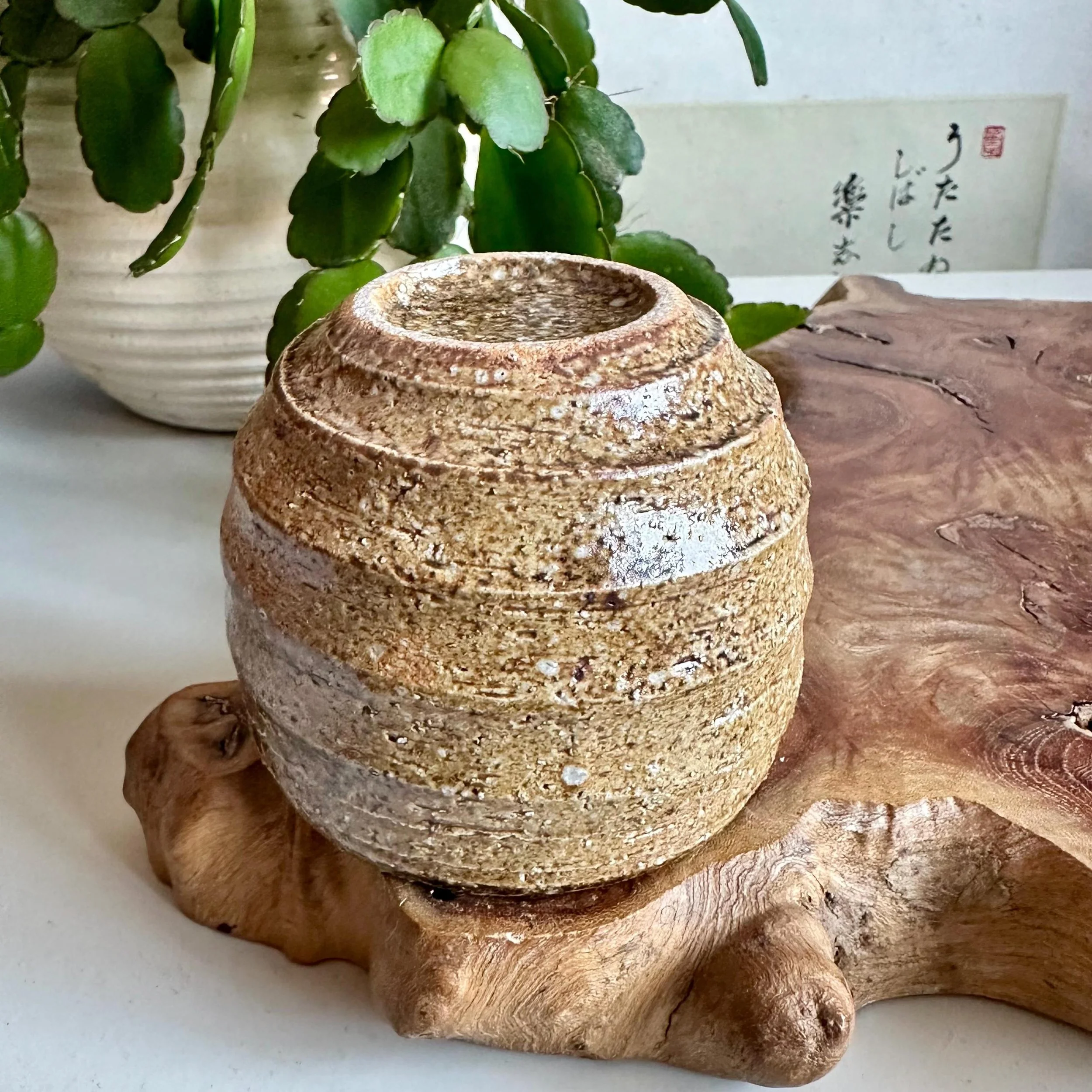 Three Shigaraki-yaki cups, Royal Yamamoto studio sticker visible on centre piece
