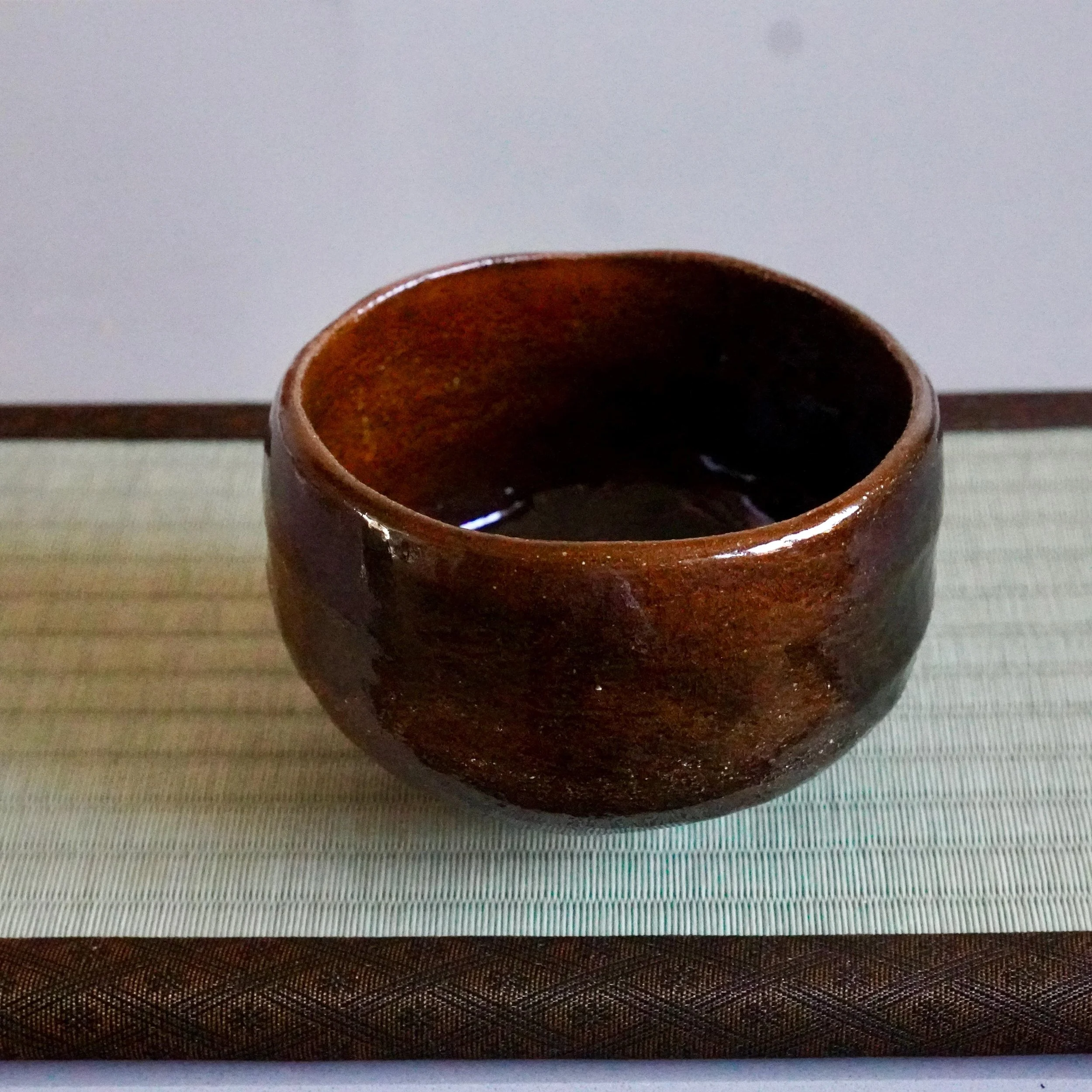 Ōbi-yaki chawan interior, Kanazawa piece, deep glaze pooling toward the base