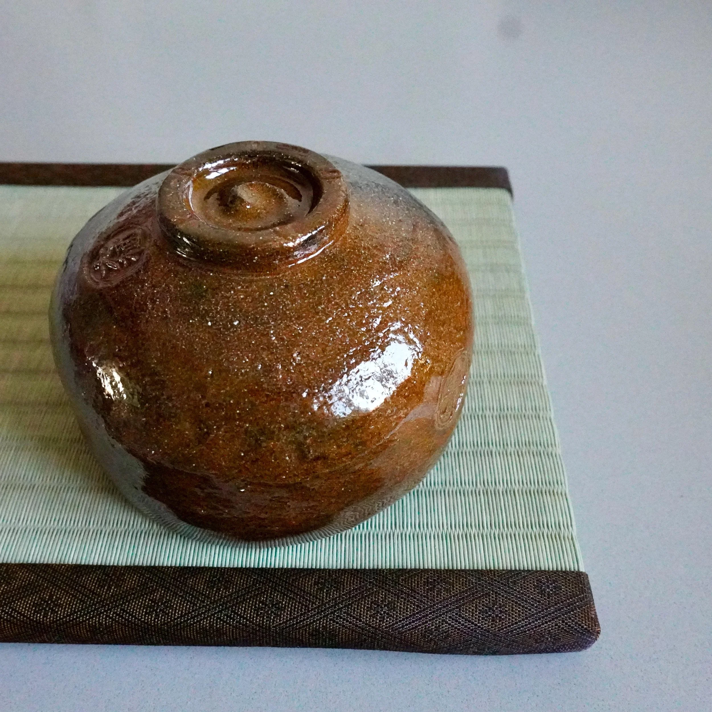 Ōbi-yaki chawan overhead angle, Kanazawa, floral stamp and glaze flow showa
