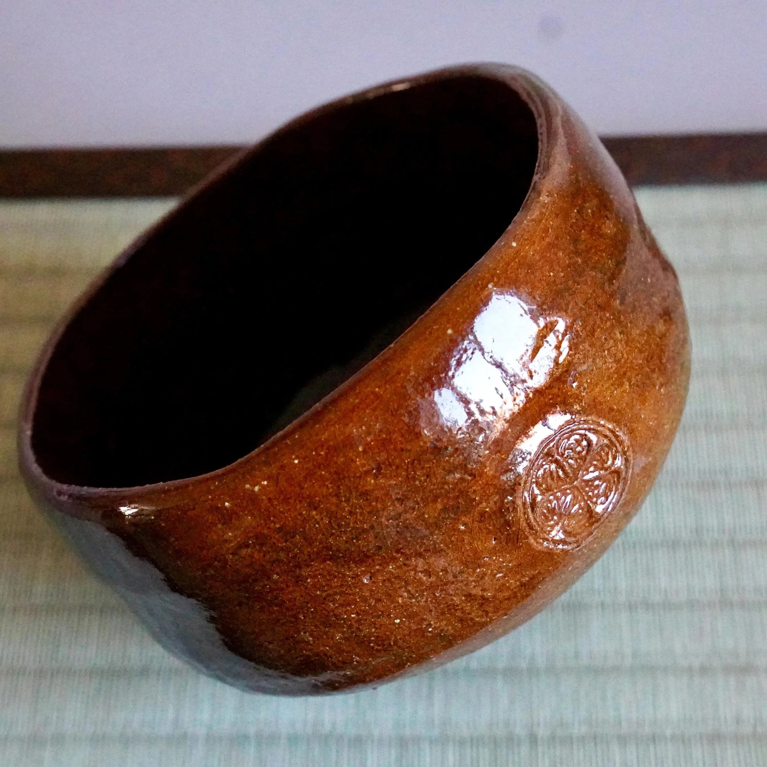 Ōbi-yaki chawan full body view, Kanazawa, floral stamp on lower side showa