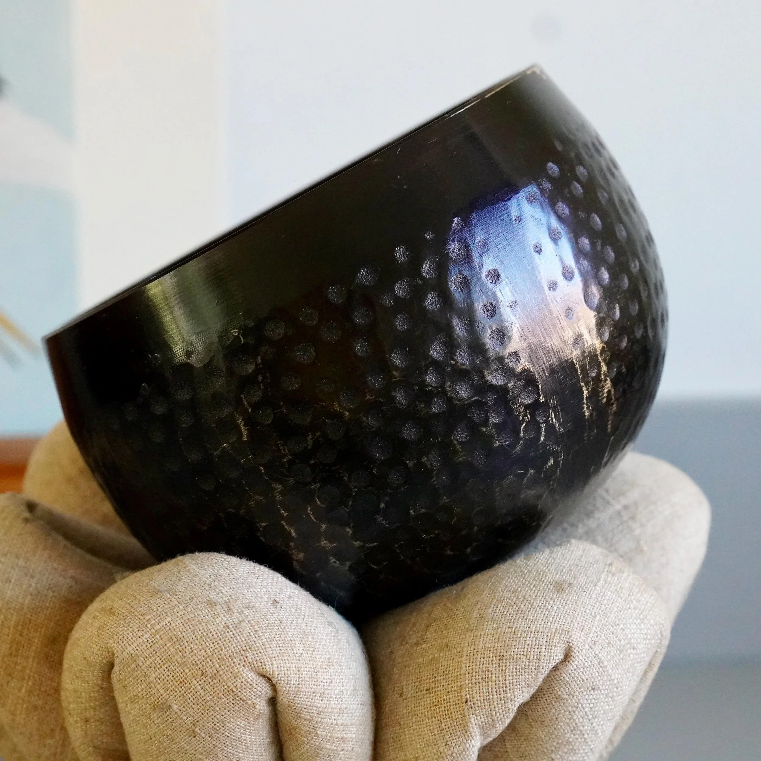 Hammered bronze orin bowl, close view of tsuchime texture