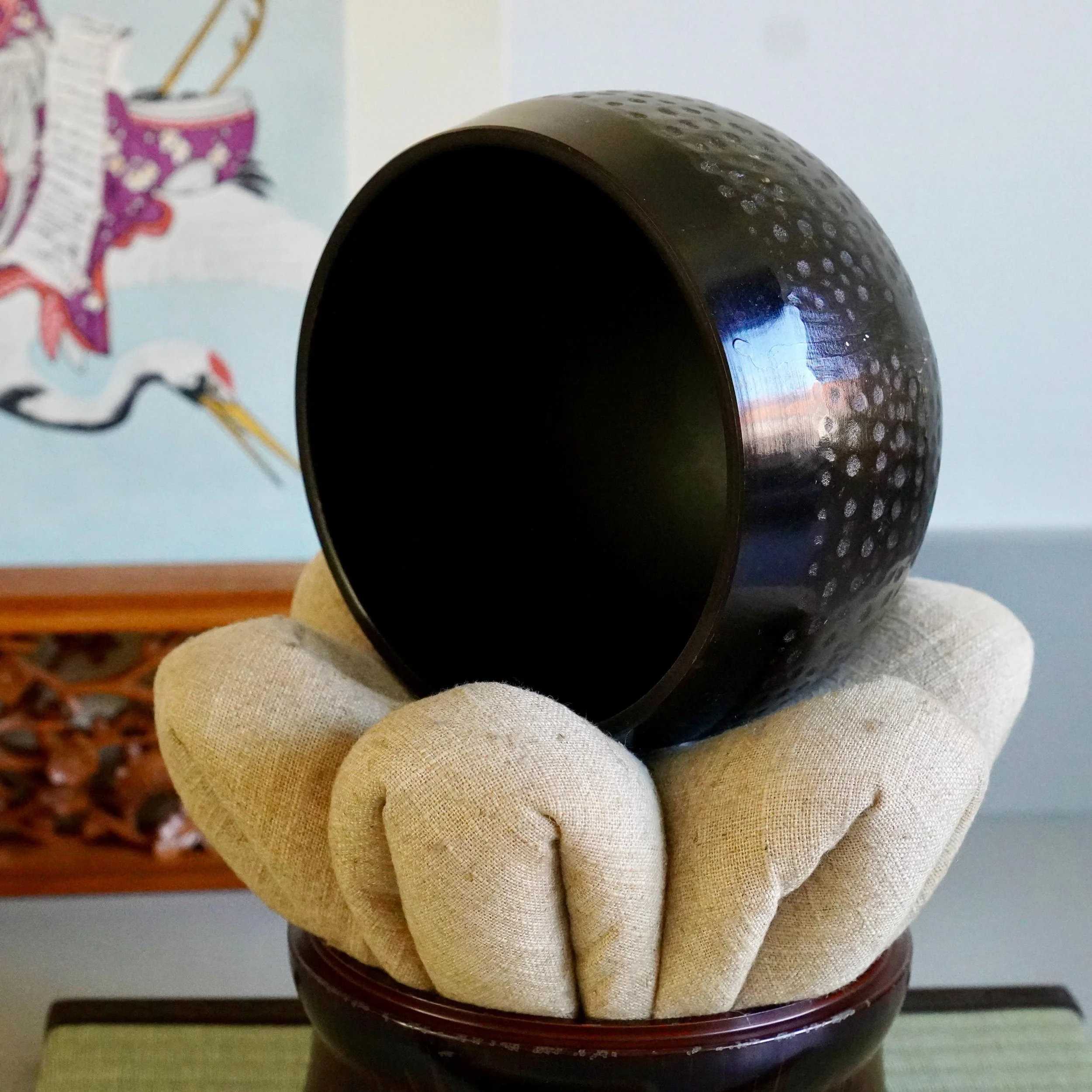 Orin singing bowl tilted to show interior and hammered rim
