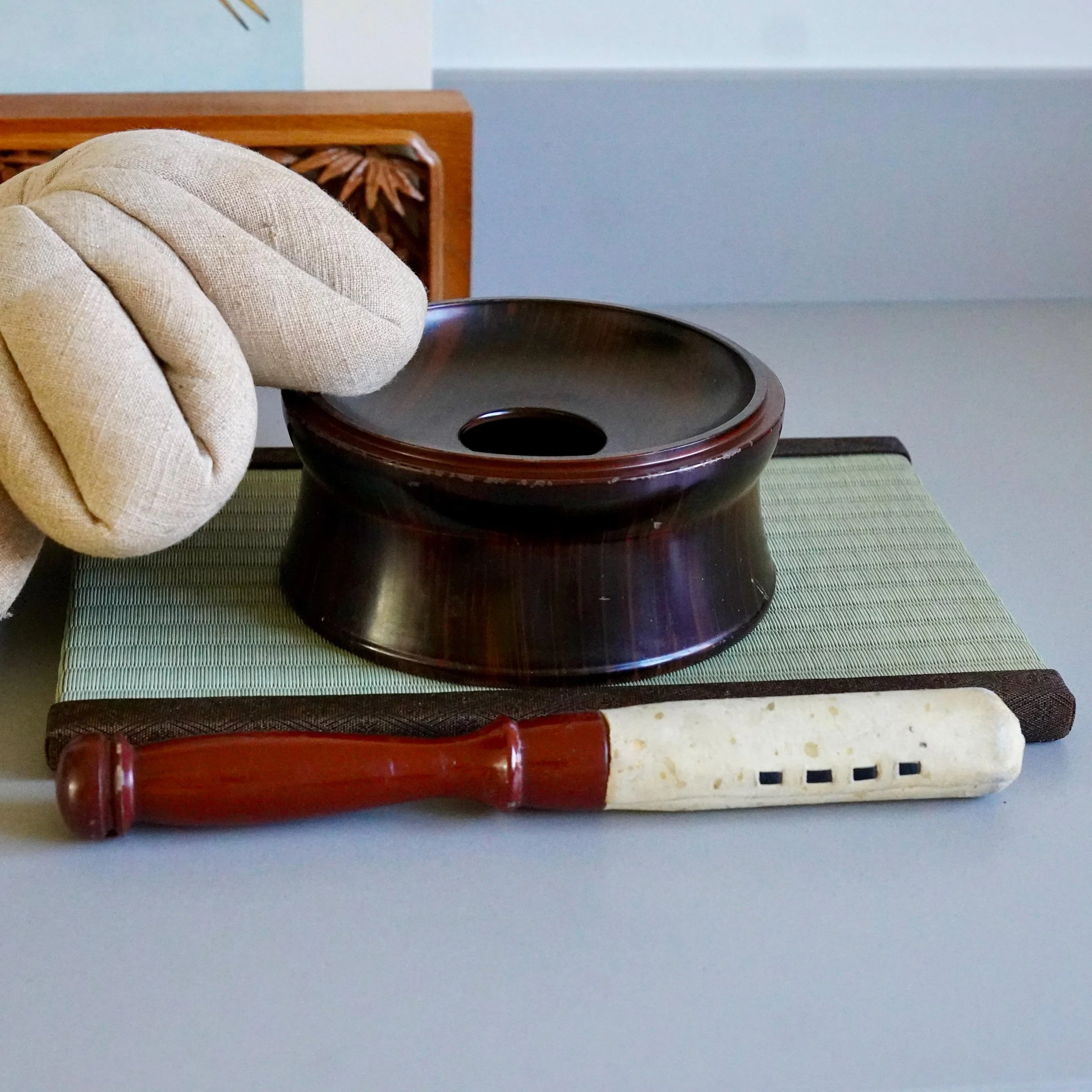 Dark red lacquered wood stand for orin bell, overhead view
