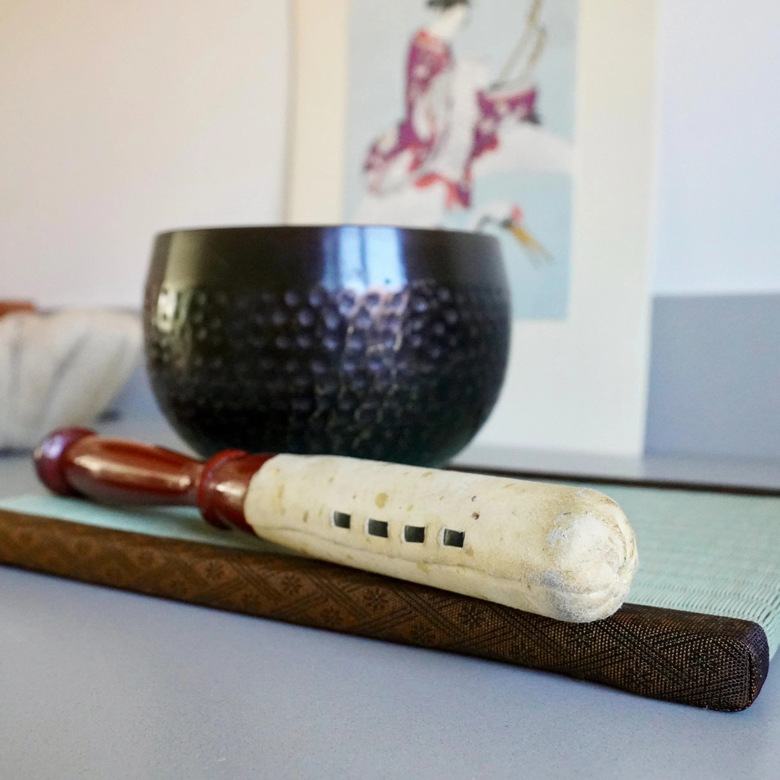 Complete orin singing bowl set with striker on tatami mat