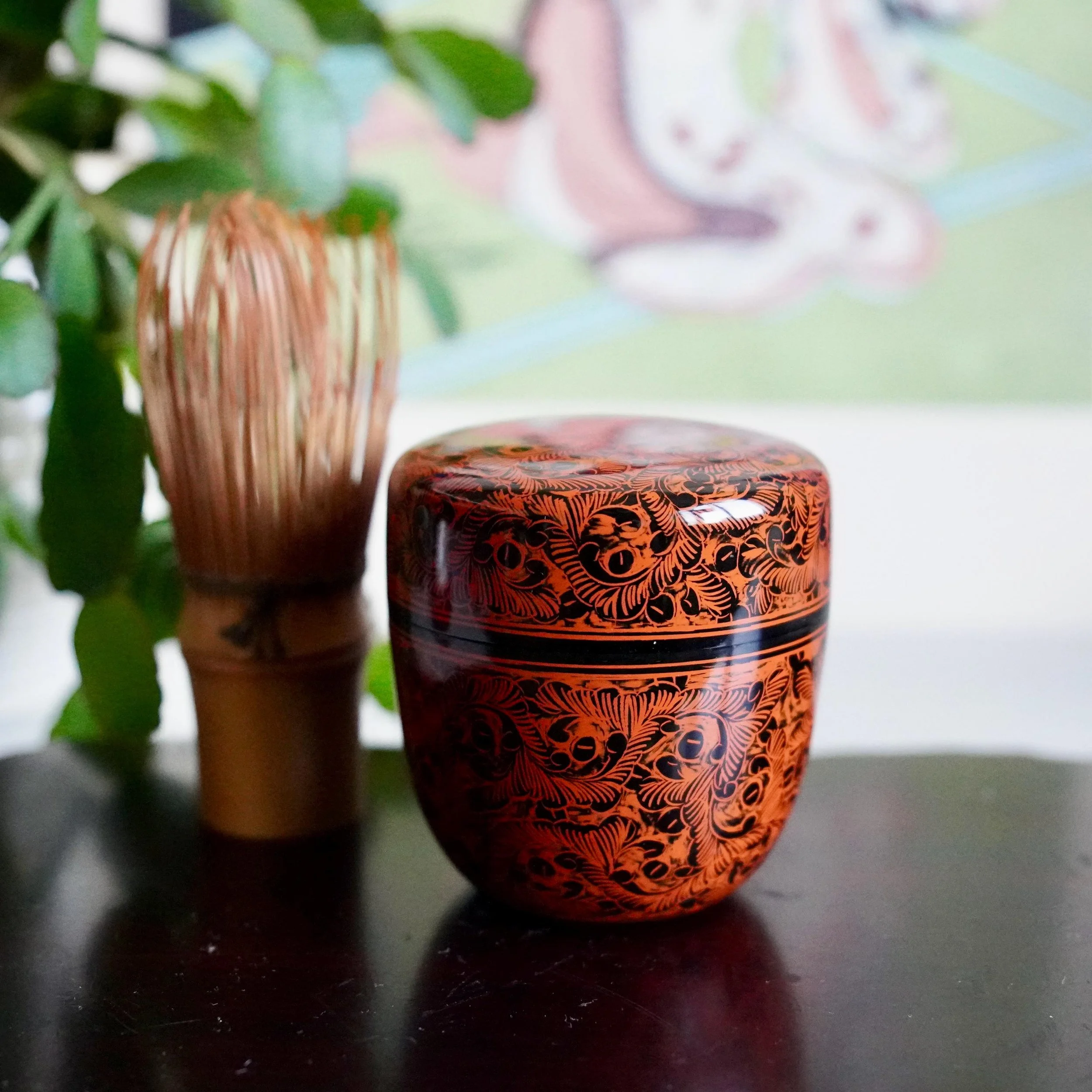 Kinma lacquer natsume Sakamoto Setsusai red and black carved decoration with wooden tomobako, Shōwa period Japan next to chasen