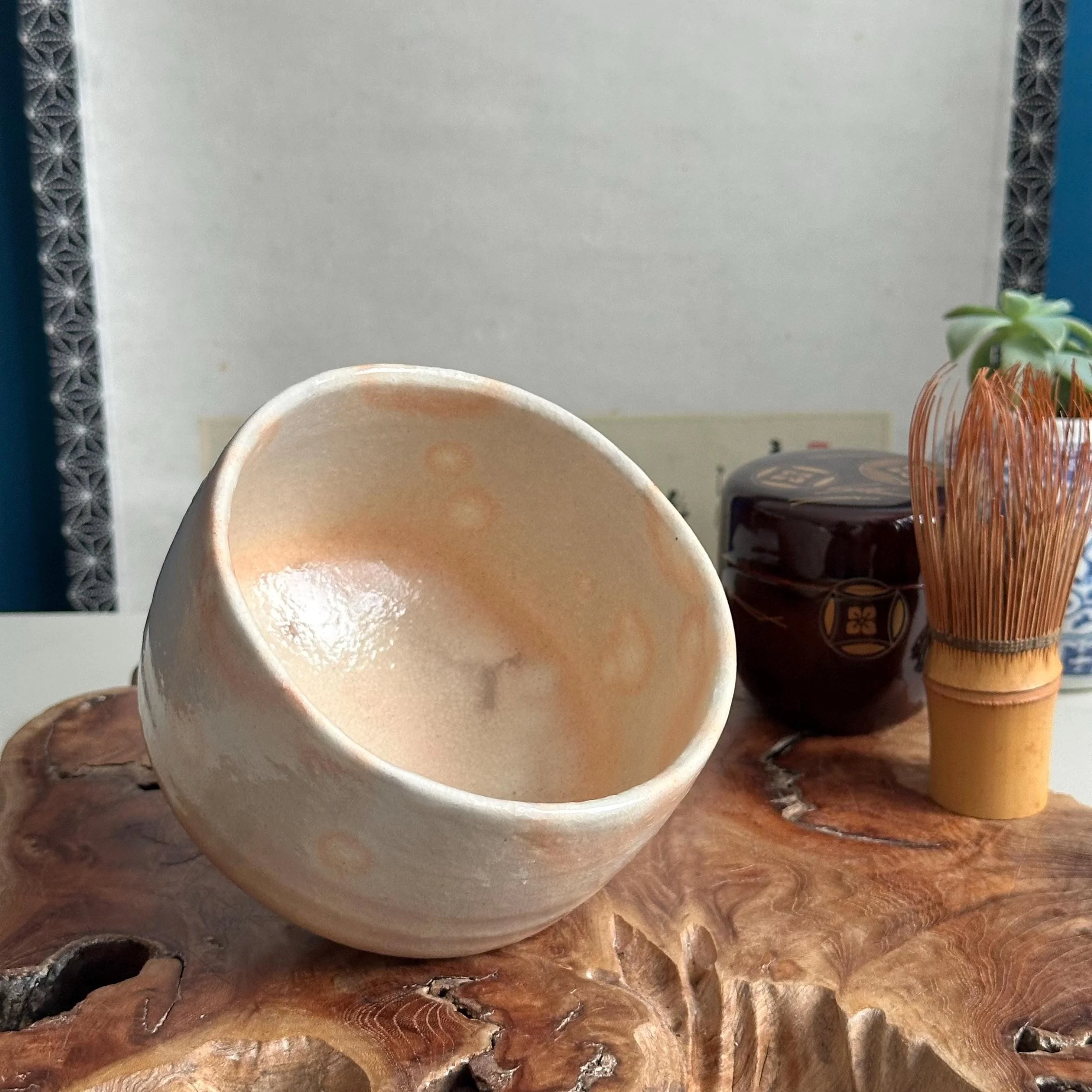 Tilted view of Hagi-yaki gohonde chawan showing interior and exterior glaze together