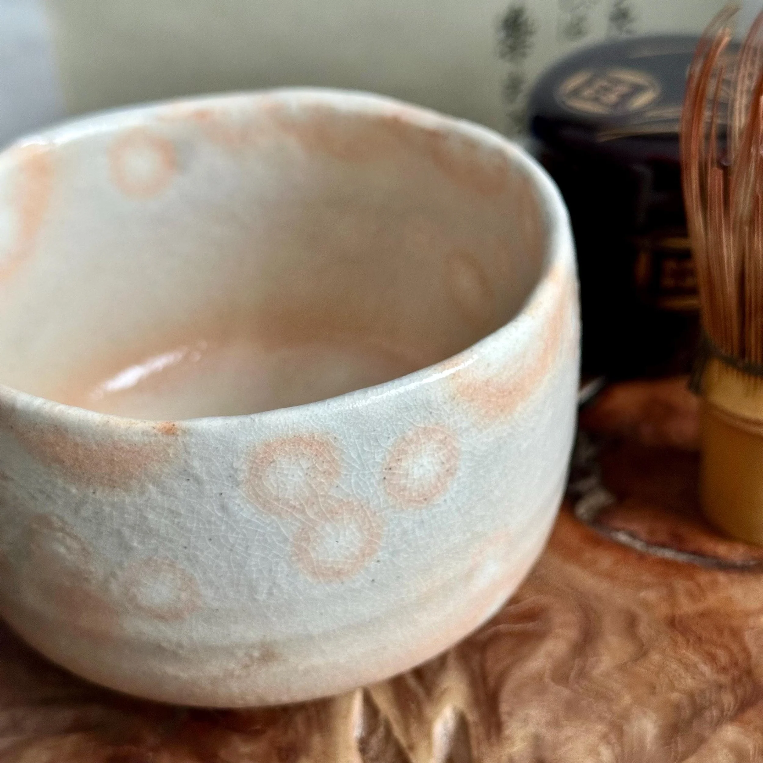 Close up angle of gohonde pink spotting and kannyu crackle on Hagi-yaki chawan