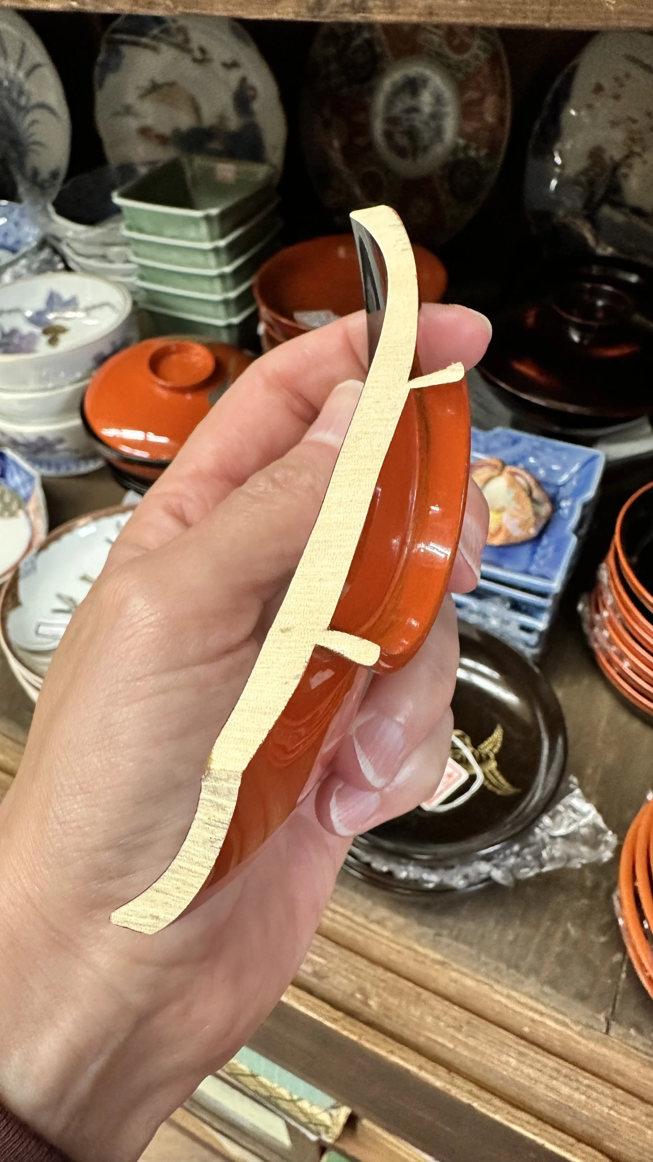 Cross-section of broken lacquer piece showing wood grain and lacquer layers, Matsuyama