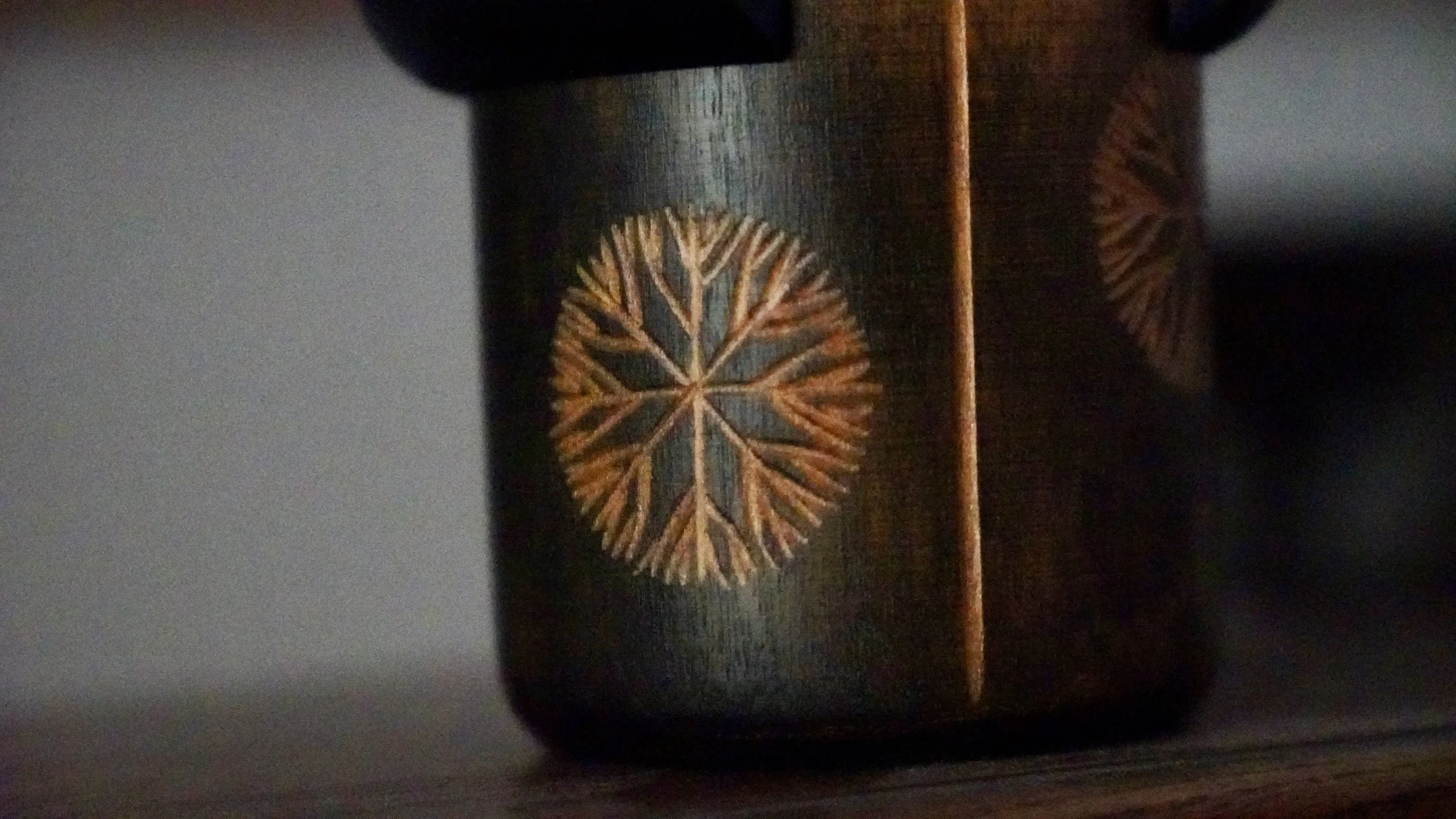 Sansaku Sekiguchi kokeshi chrysanthemum dark zelkova engraved close-up