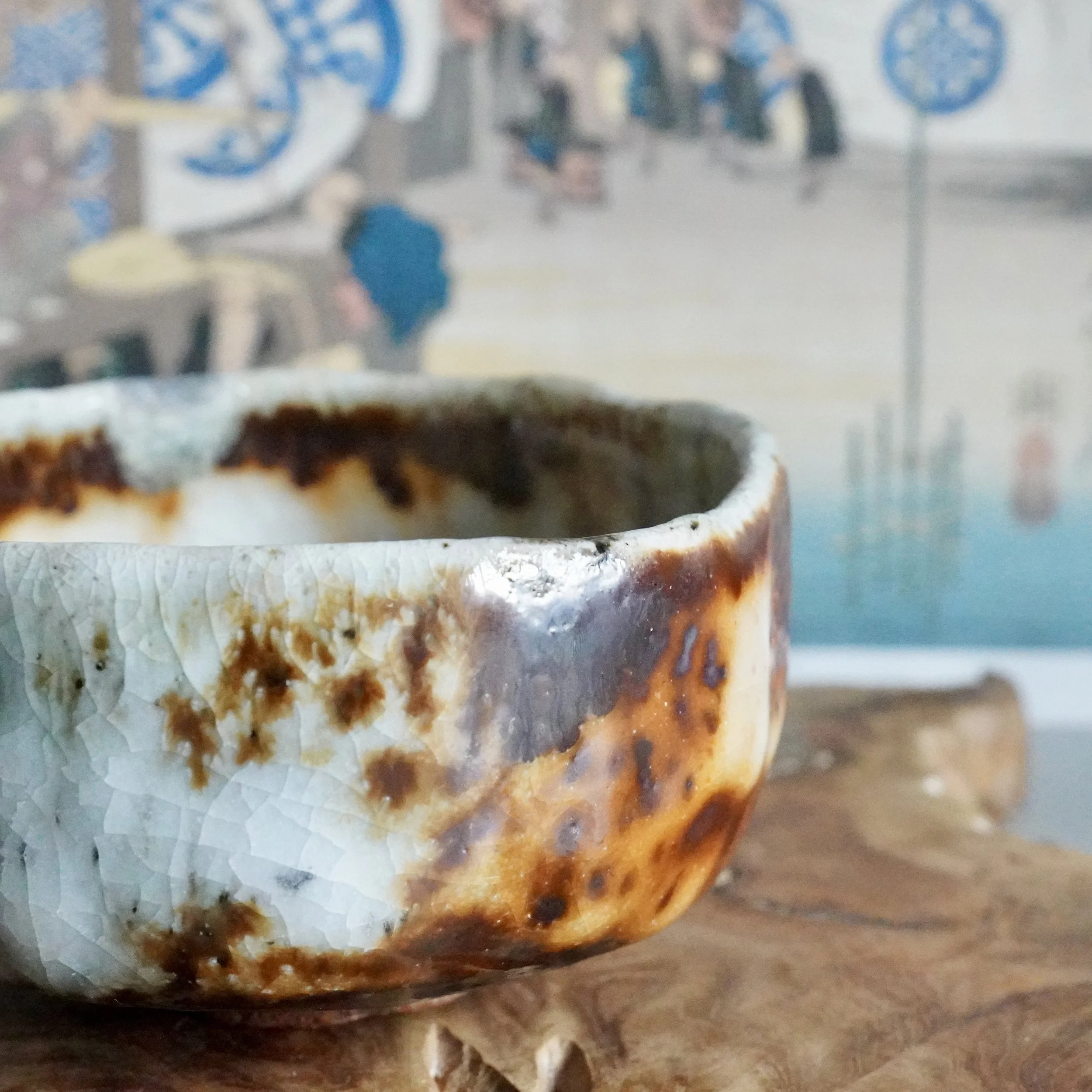 Rim detail of a Deguchi Eiji chawan showing grey-blue crystals formed in the glaze during wood firing
