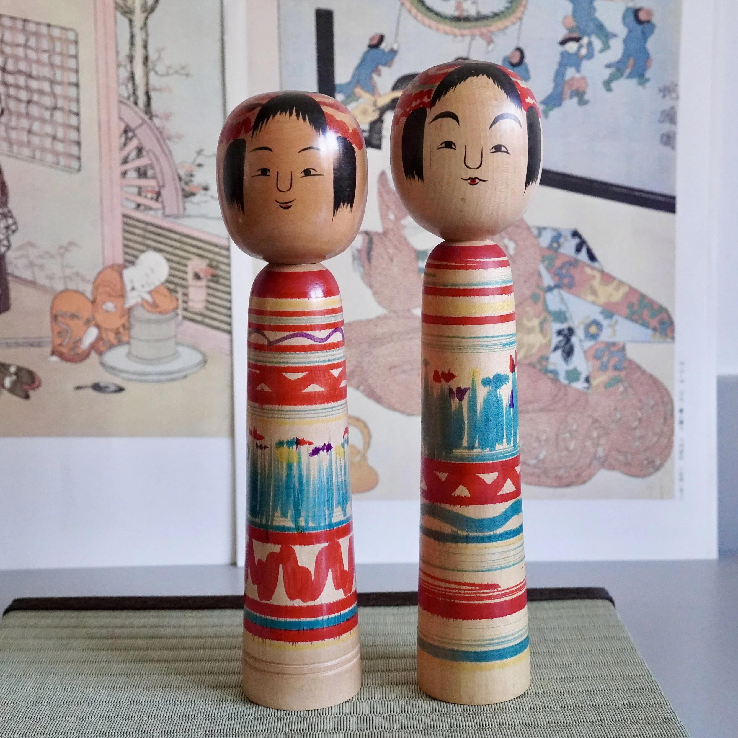 Vintage Tsuchiyu kokeshi doll pair, signed by Jinnohara Kazunori, Japanese wooden folk art.