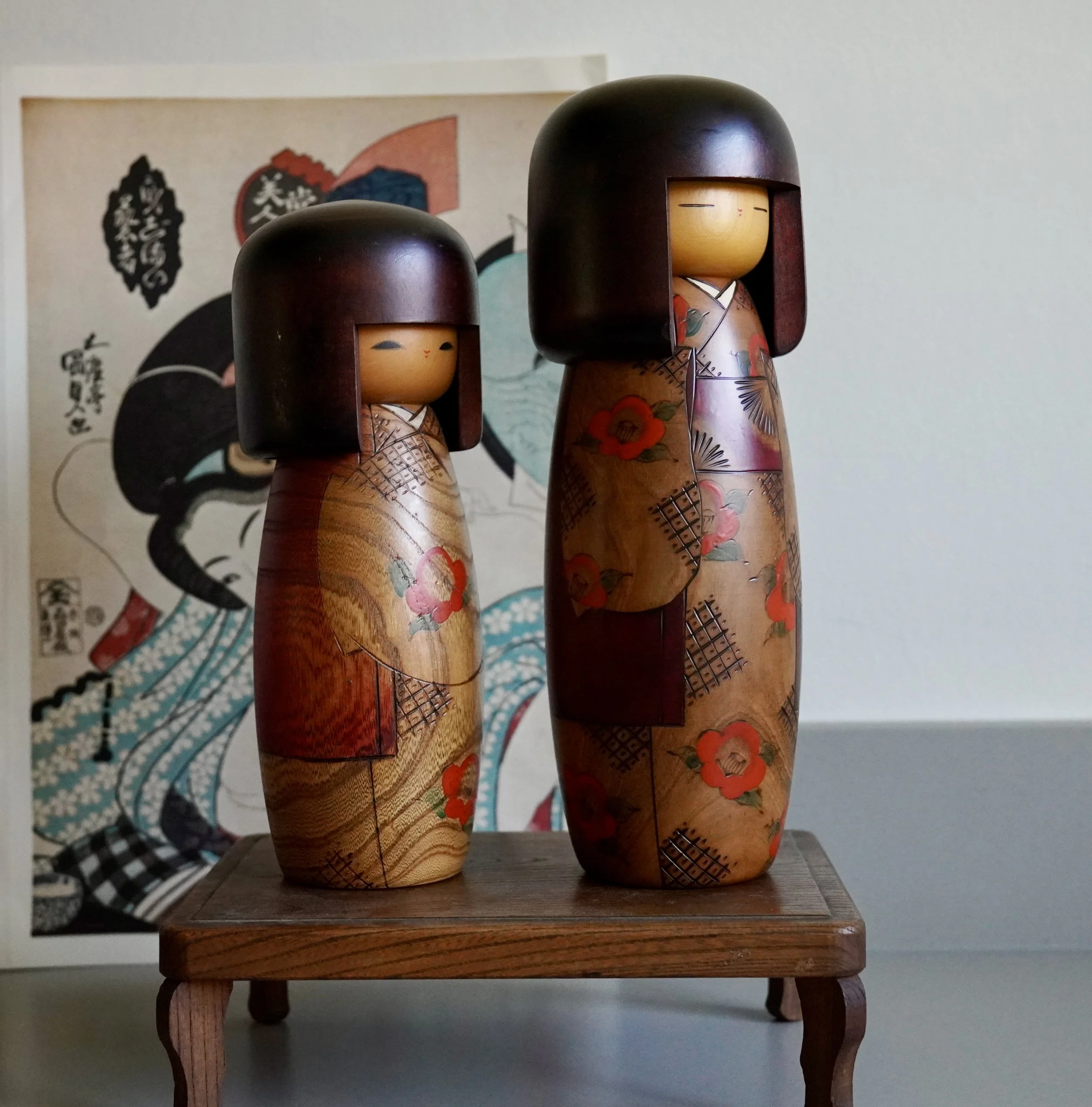 Usaburo sosaku kokeshi pair side view studio seal zelkova Showa