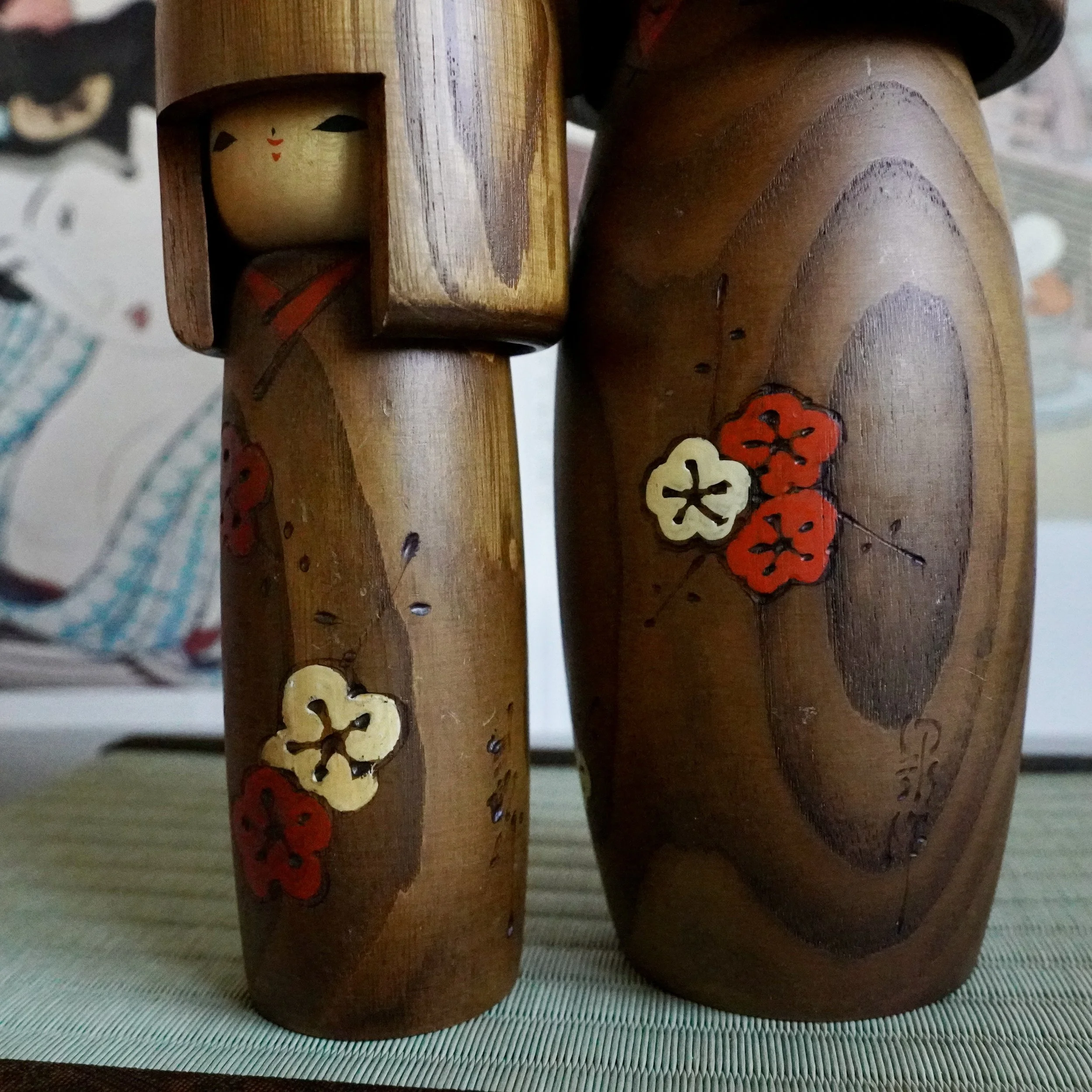 Usaburo kokeshi pair natural wood hair ume plum blossom styled angle view