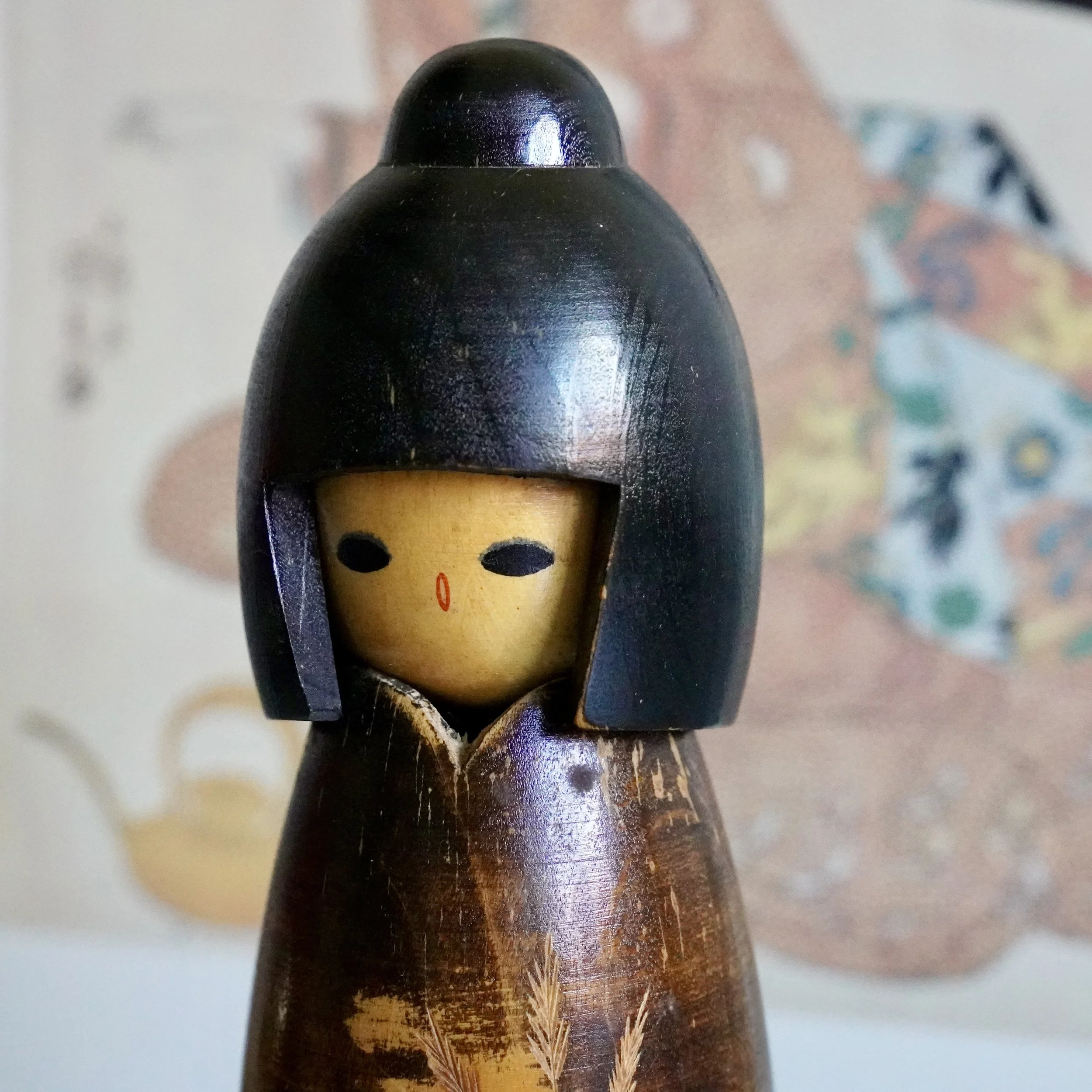 Takeda Masashi kokeshi face detail, dark lacquered wood, Shōwa period