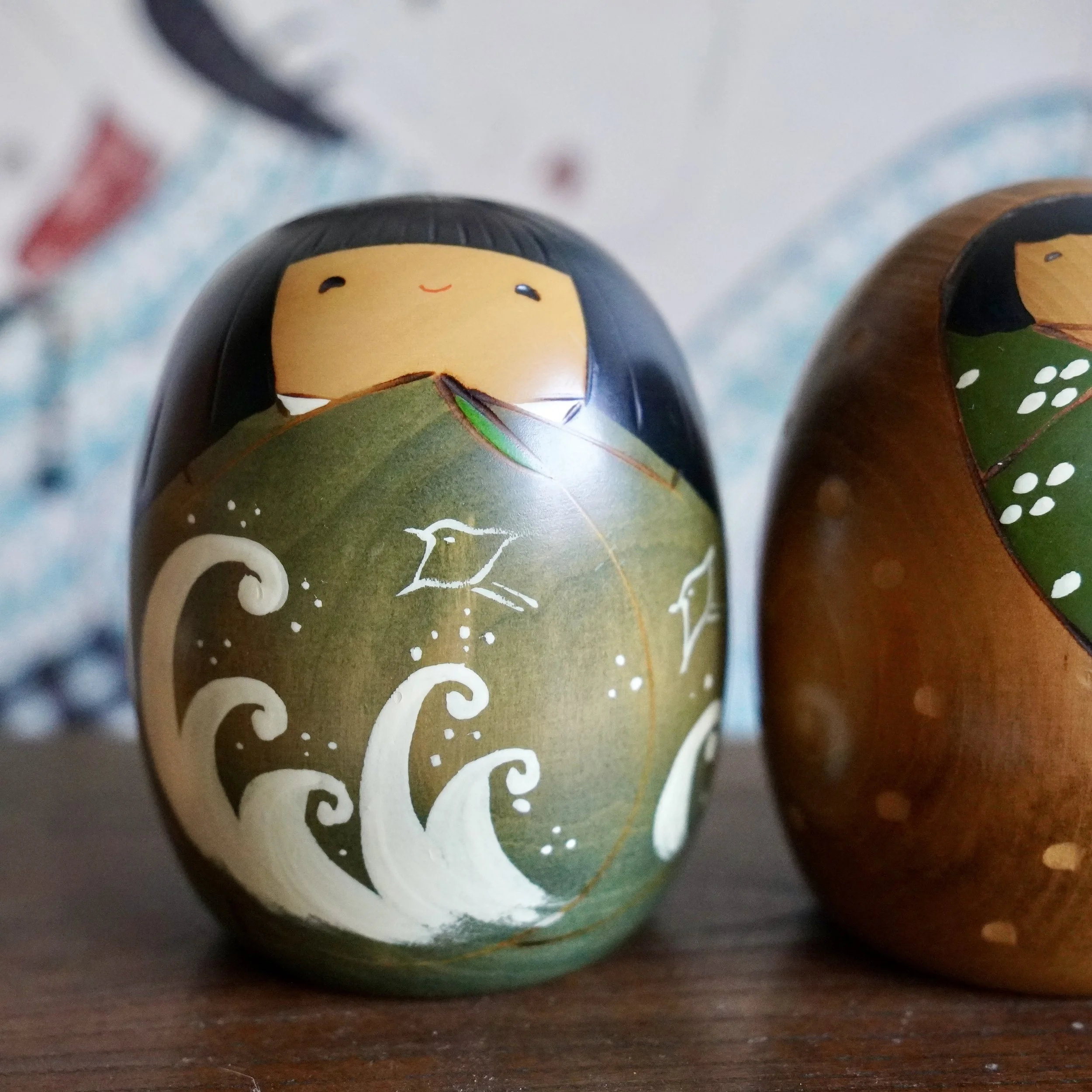 Vintage Usaburo kokeshi pair, wave and snow motif, Shiki no Uta four seasons series, Showa period Japan