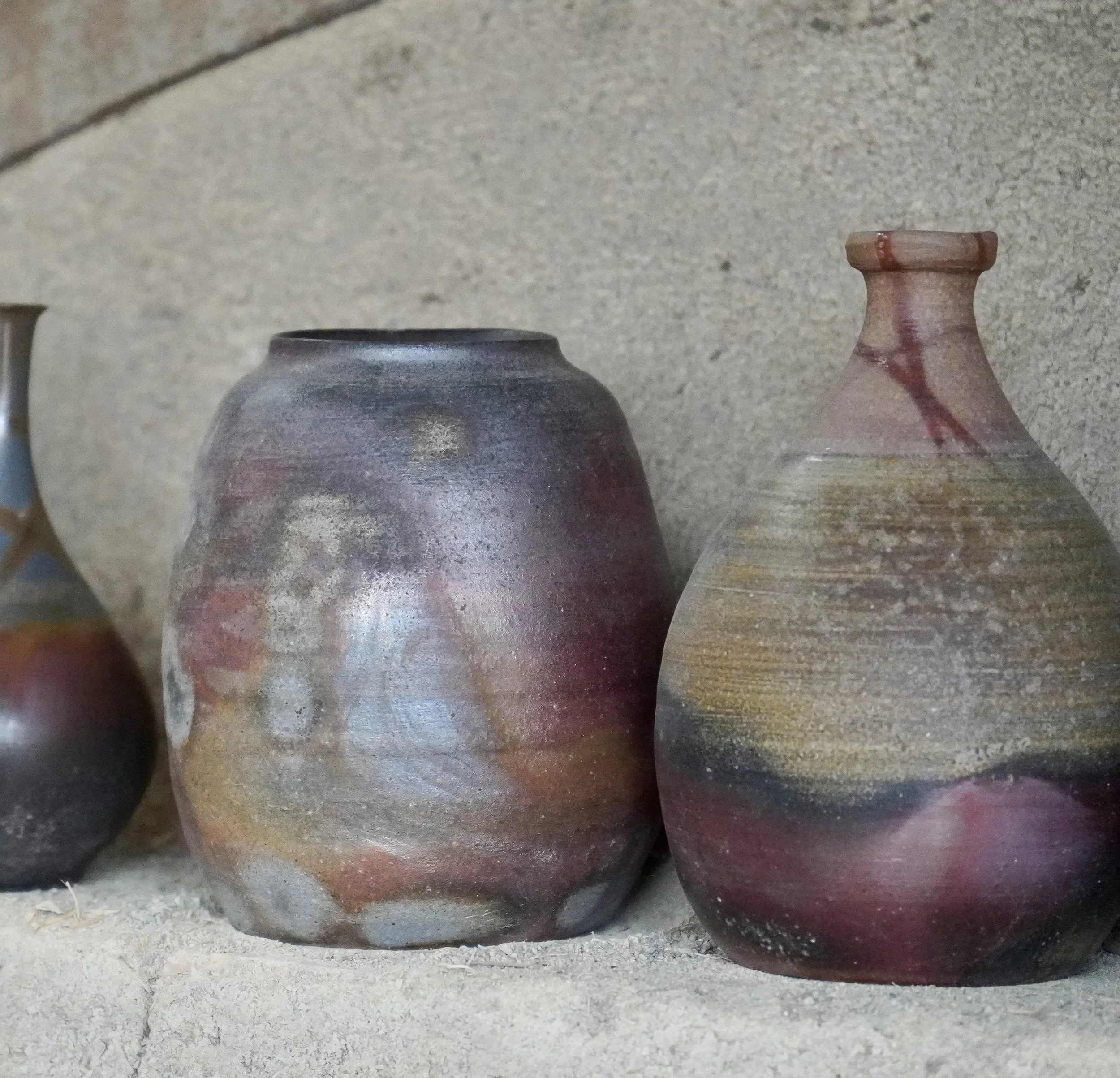 Bizen-yaki vases with goma tamadare pooled ash deposits in ochre-gold on dark red-brown yakishime clay, wood-fired unglazed stoneware Imbe Okayama Japan