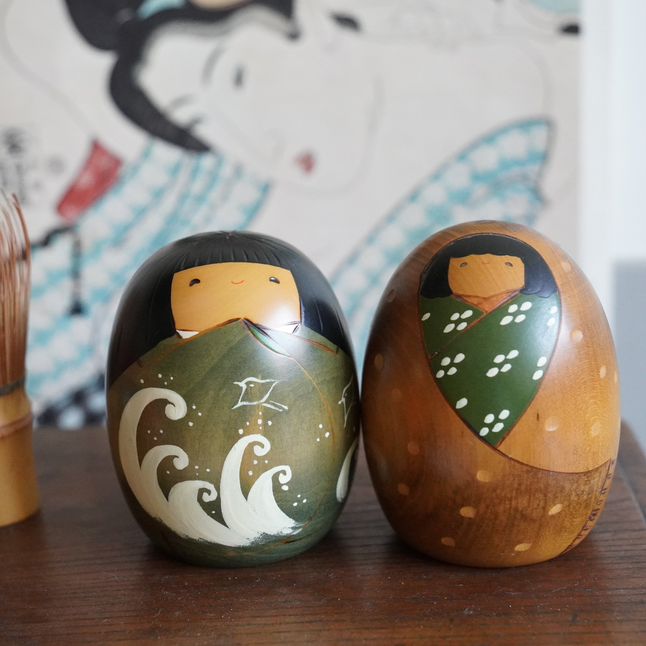 Vintage Usaburo kokeshi pair, summer wave motif and winter snow motif, Shiki no Uta four seasons series, Showa period