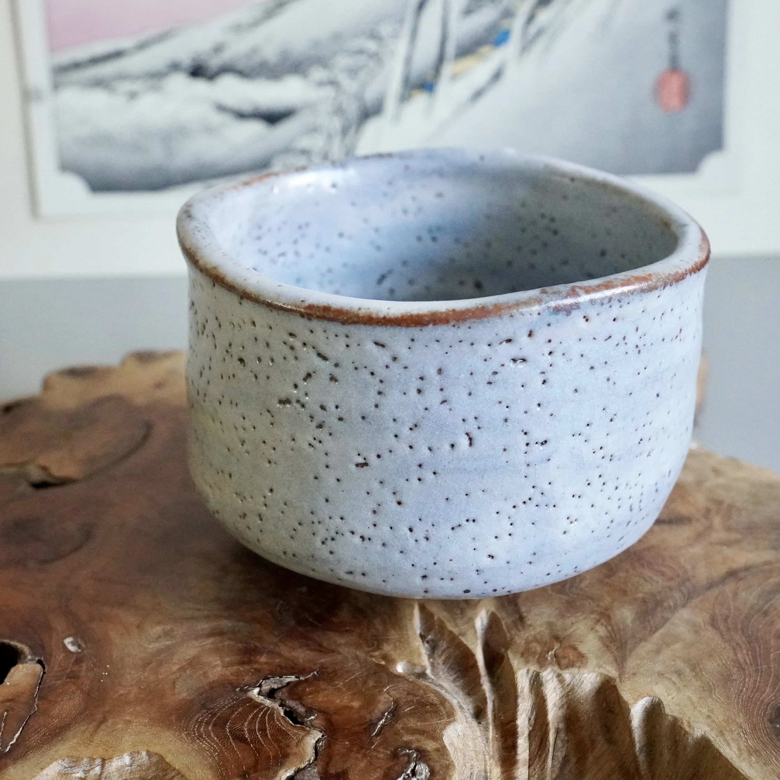 Shino chawan front view, white to blue grey glaze, fire blush rim