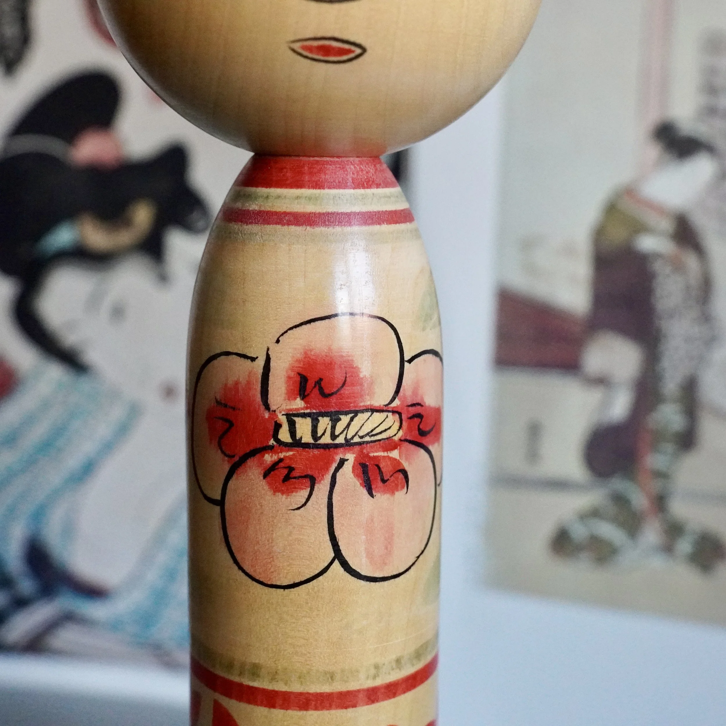 Detail of hand painted peony on Nakanosawa Takobozu kokeshi body, signed vintage kokeshi by Saito Tokuju