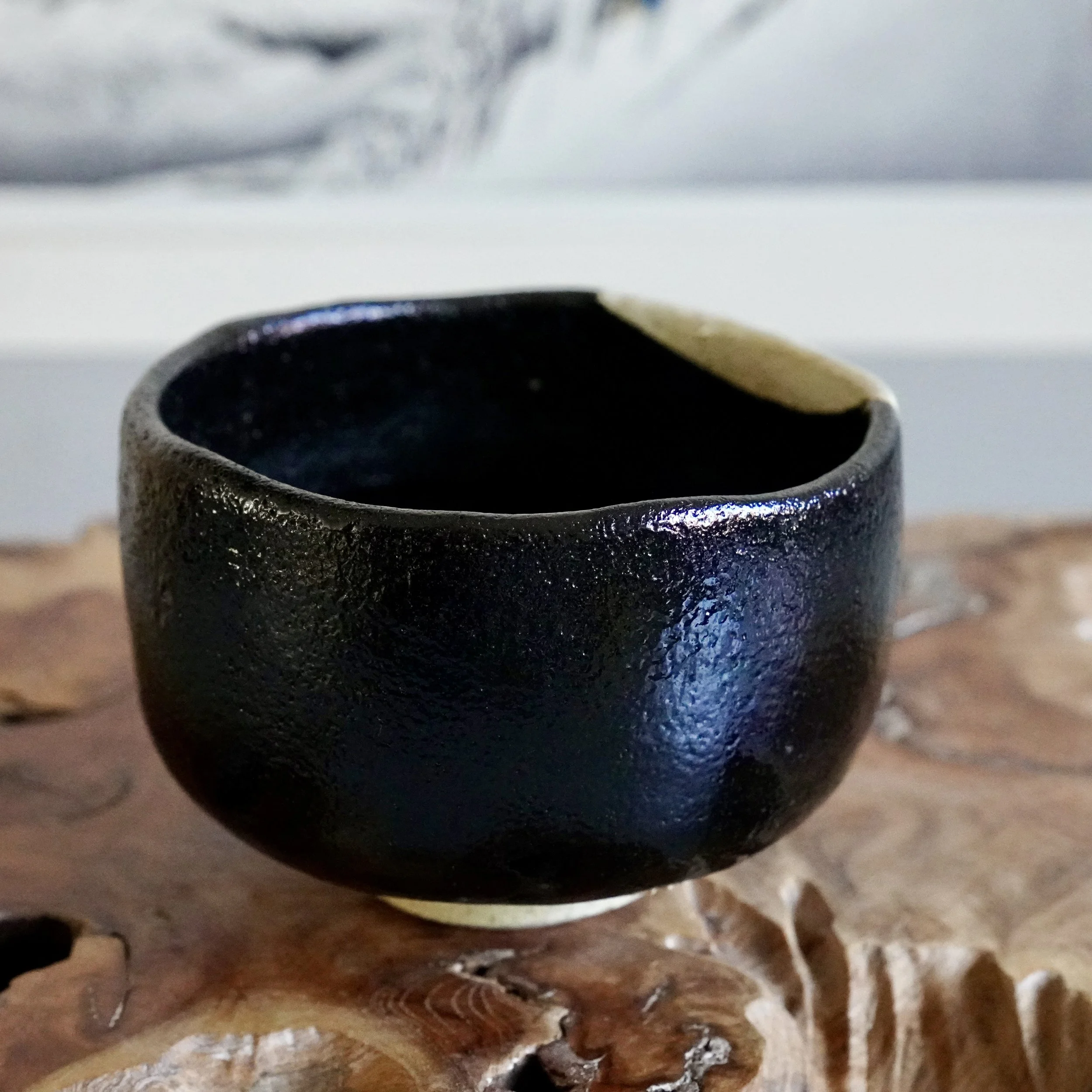 Back view of kuro chawan, deep black glaze, tea ceremony bowl