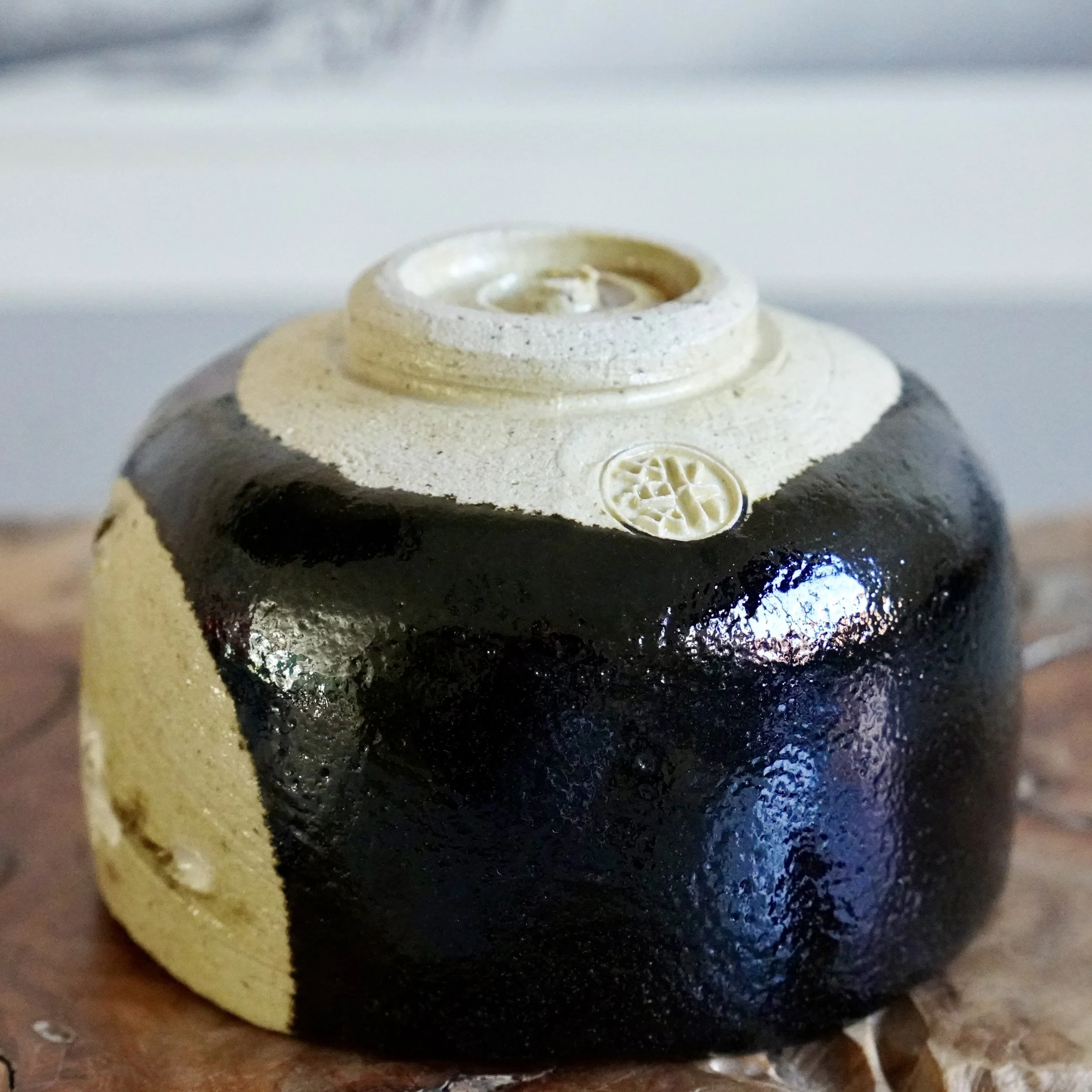 Unglazed foot of kuro chawan showing impressed seal mark