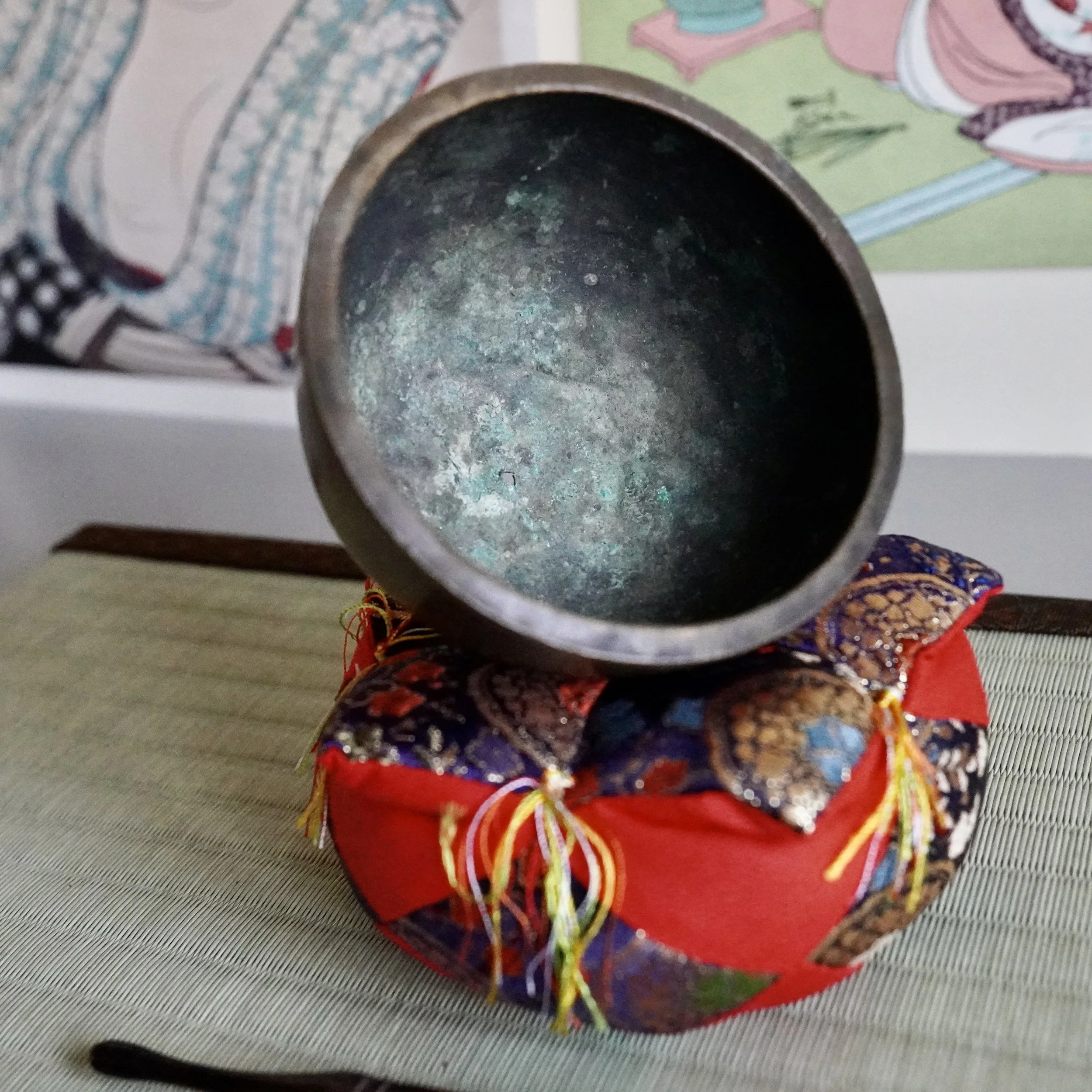 Interior of small bronze orin singing bowl showing aged patina
