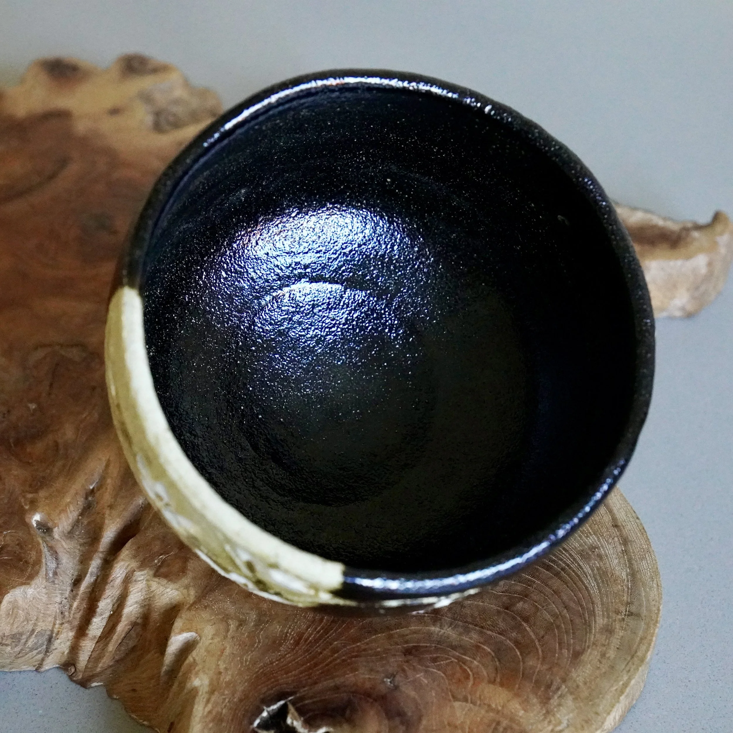Overhead interior view of black glazed kuro chawan