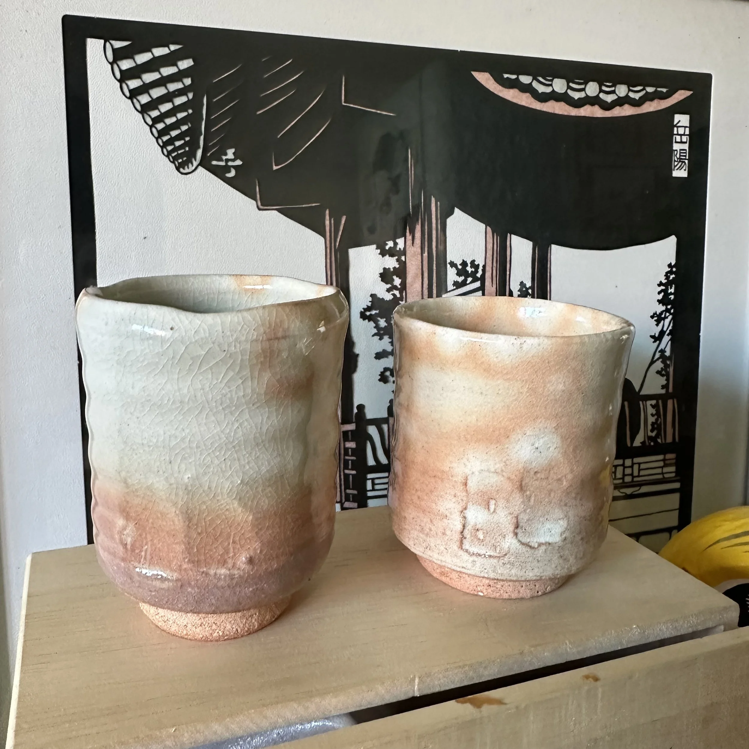 Hagi-yaki meoto yunomi pair Taizan kiln, two cups front view showing size difference and glaze contrast, kiri-kodai foot, Japan