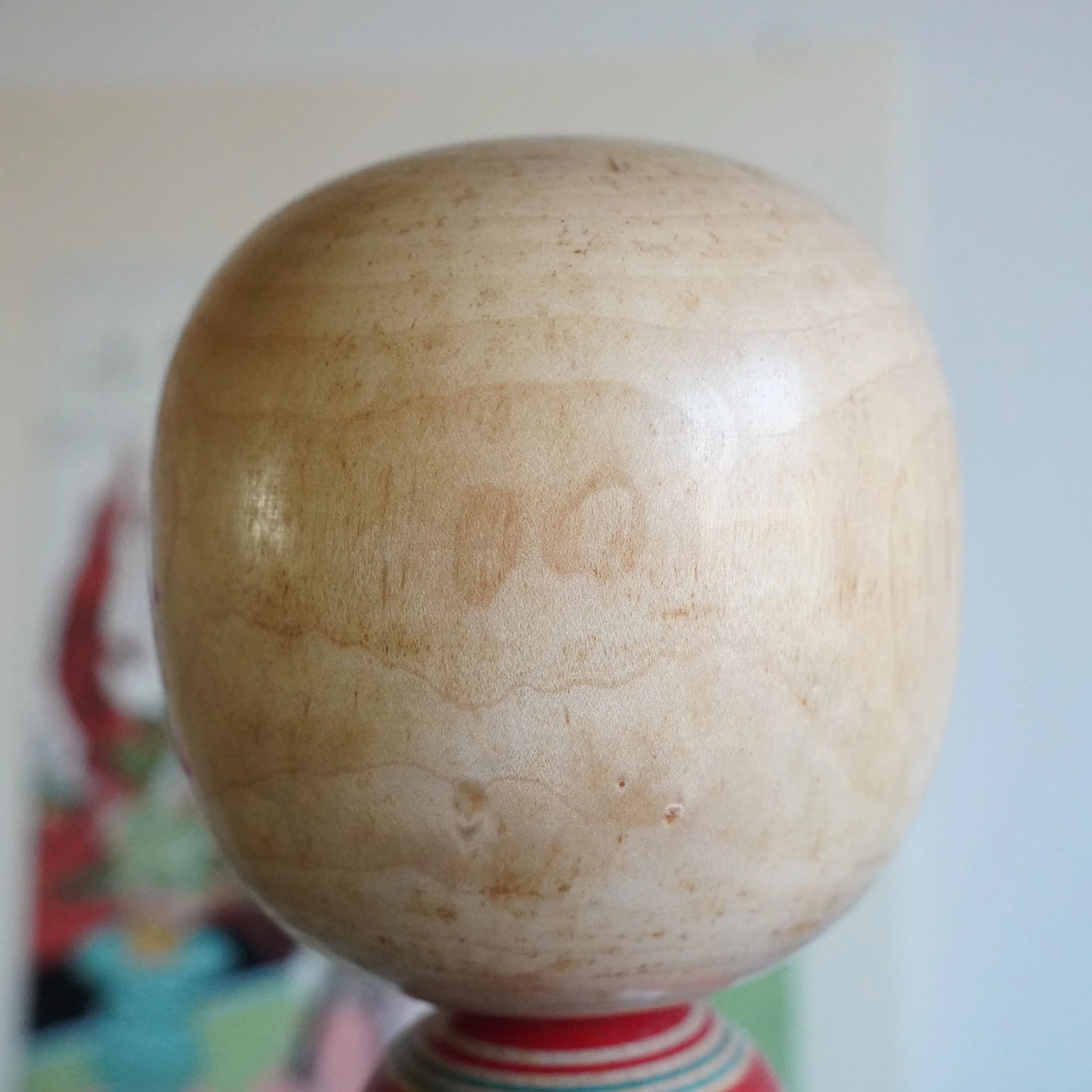 Yamagata kokeshi head back view, natural unpainted wood surface, smooth lathe-turned finish, Takasaki Eiichirō, Shōwa period Japan